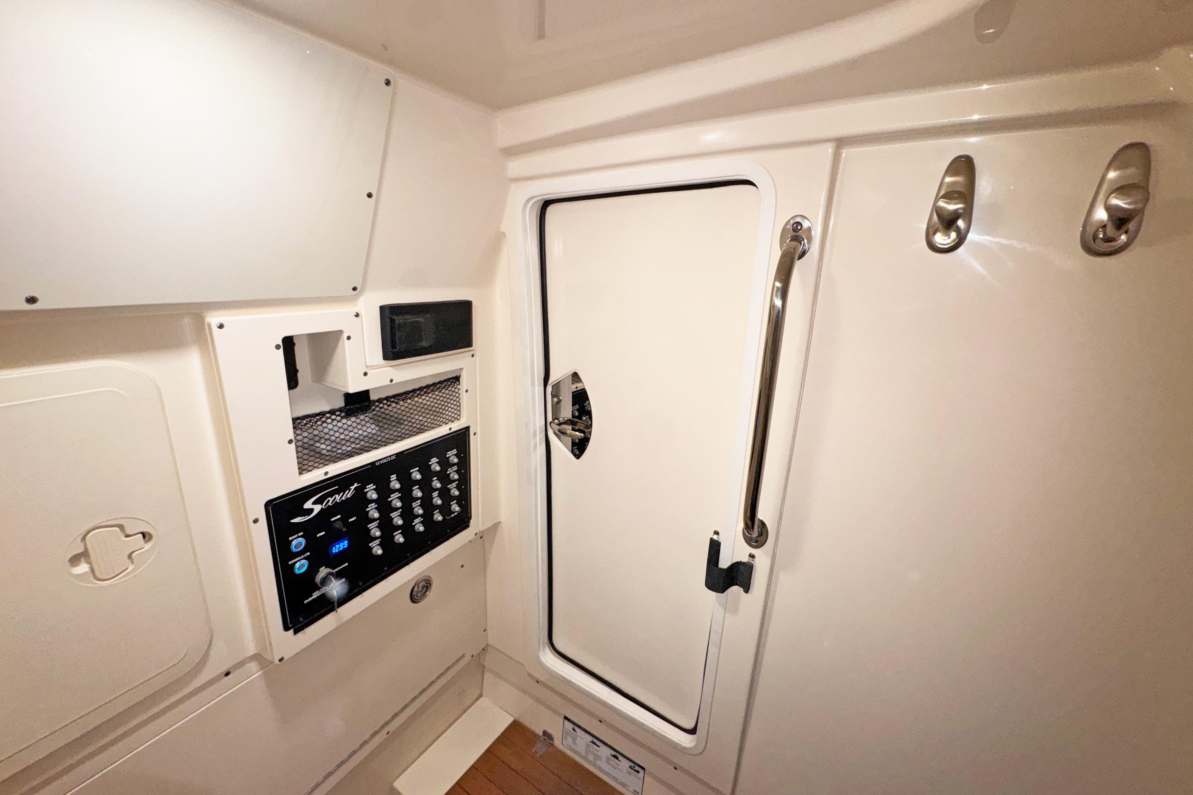 2021 Scout 305 LXF interior cabin with control panel and storage compartments.