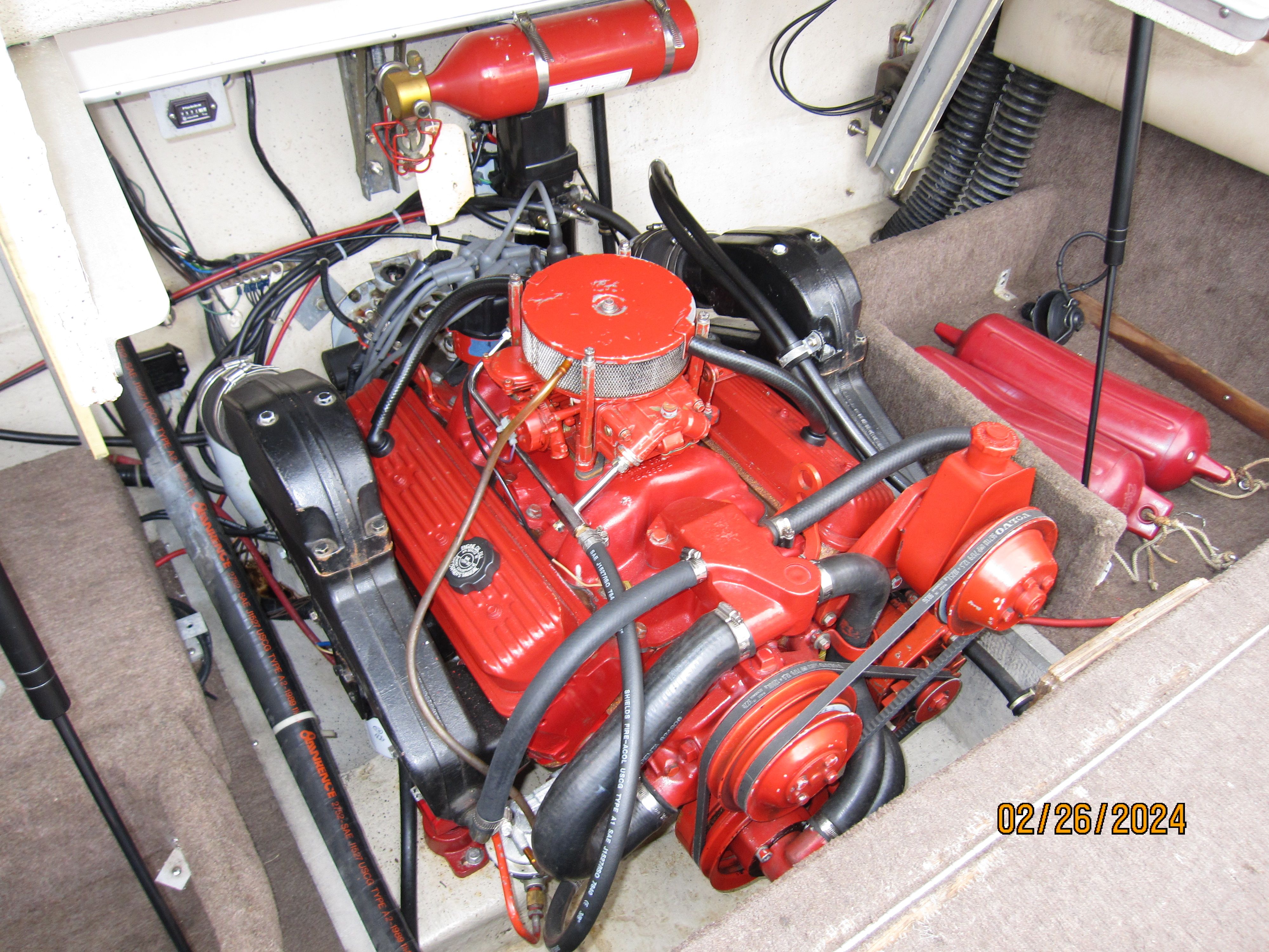Engine compartment of a 1990 Cobalt Bowrider Classic with red engine.