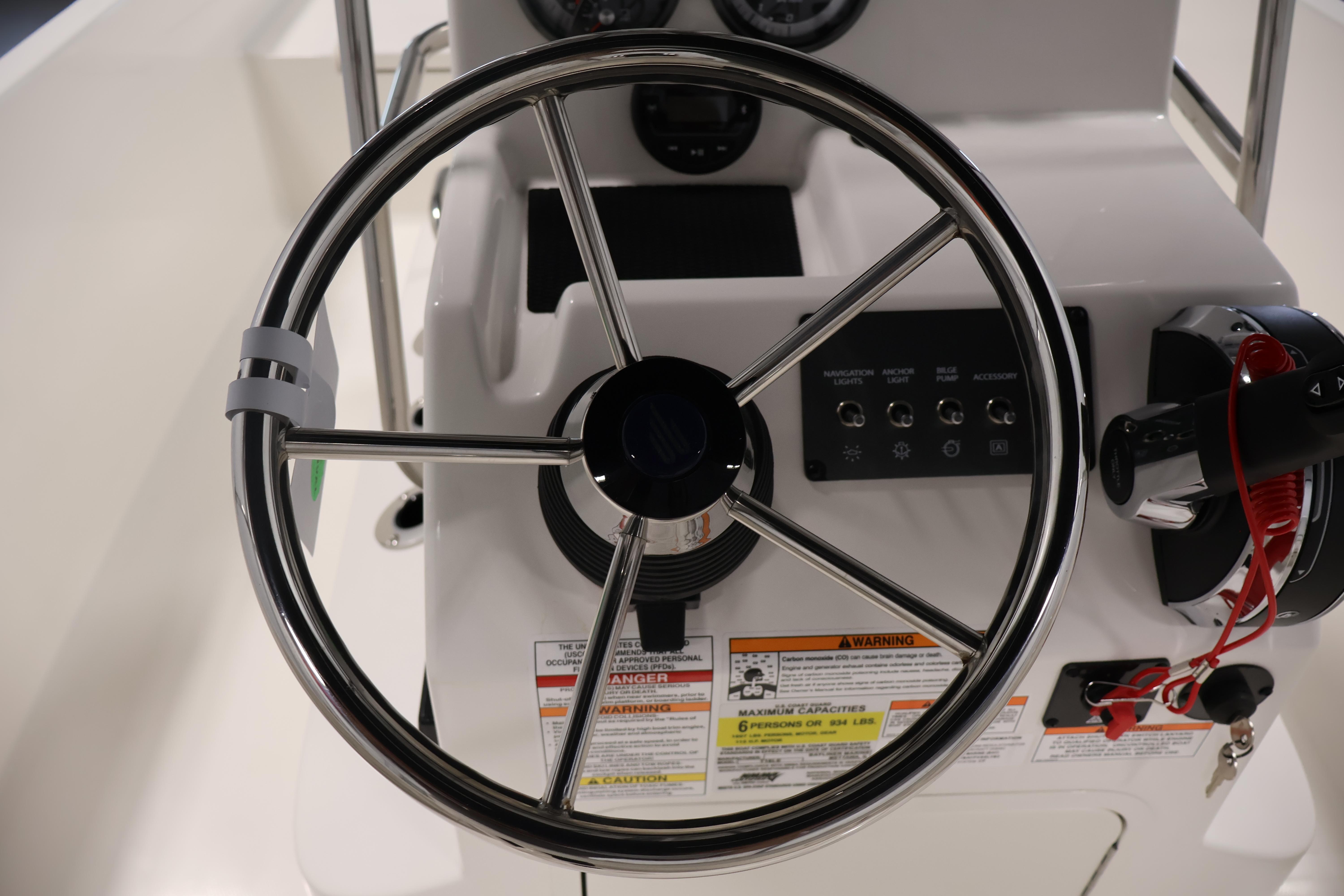Steering wheel and controls of 2026 Bayliner Trophy T18 boat.