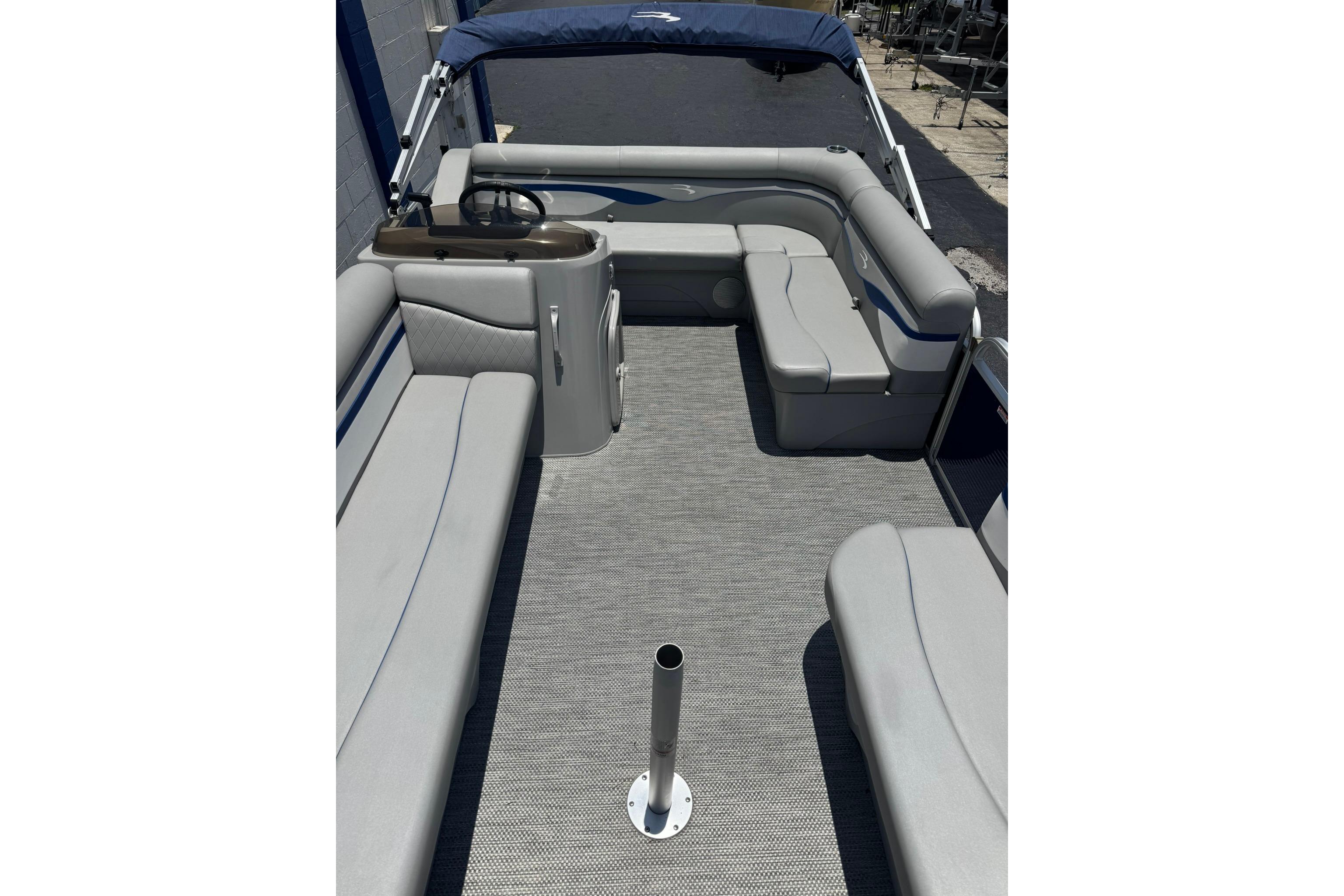 2024 Bennington SV 168 SLV 8' Narrow Beam pontoon boat interior with gray seating and helm.