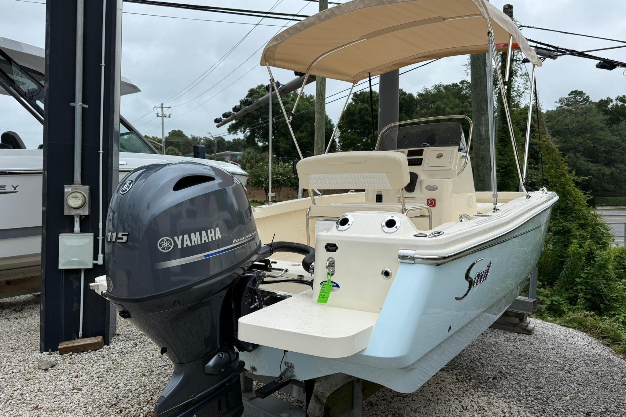 2027 Scout 188 Sportfish boat with Yamaha 115 engine, parked outdoors.