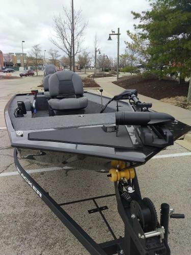 2025 Tracker Panfish 17 boat on trailer in parking lot, ready for fishing.