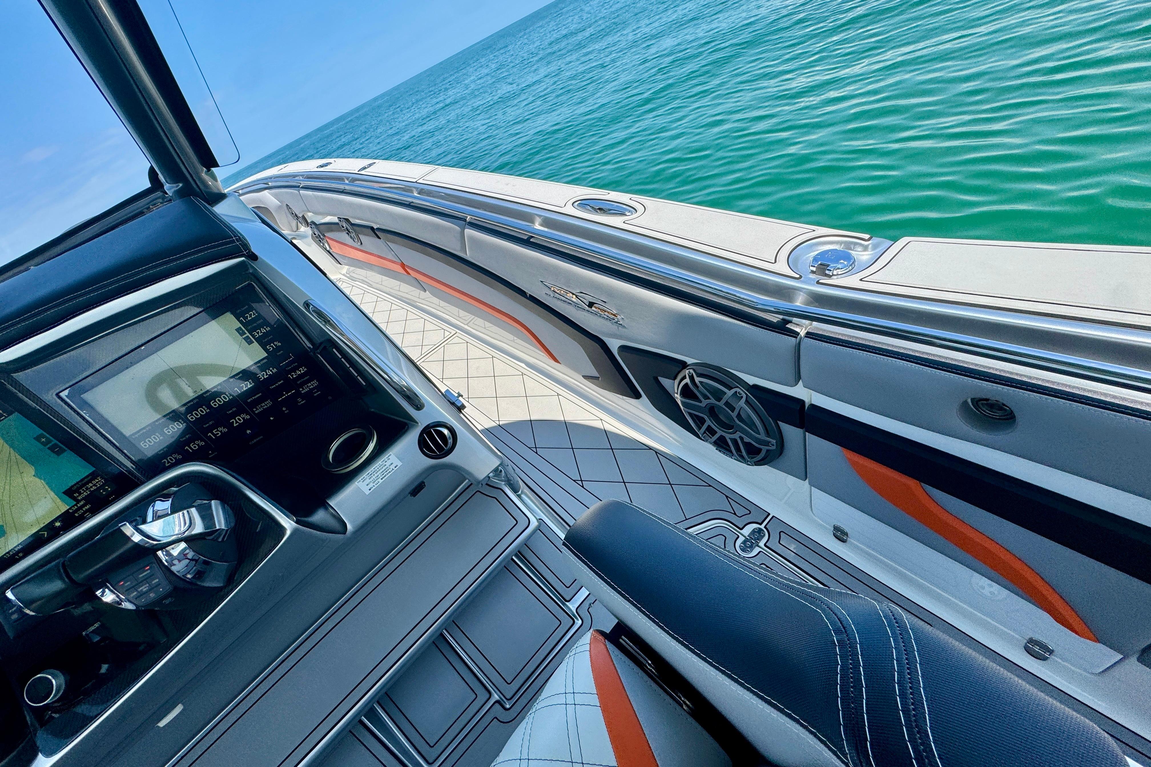 Luxury MTI V42 boat interior with sleek dashboard and ocean view, 2017 model.