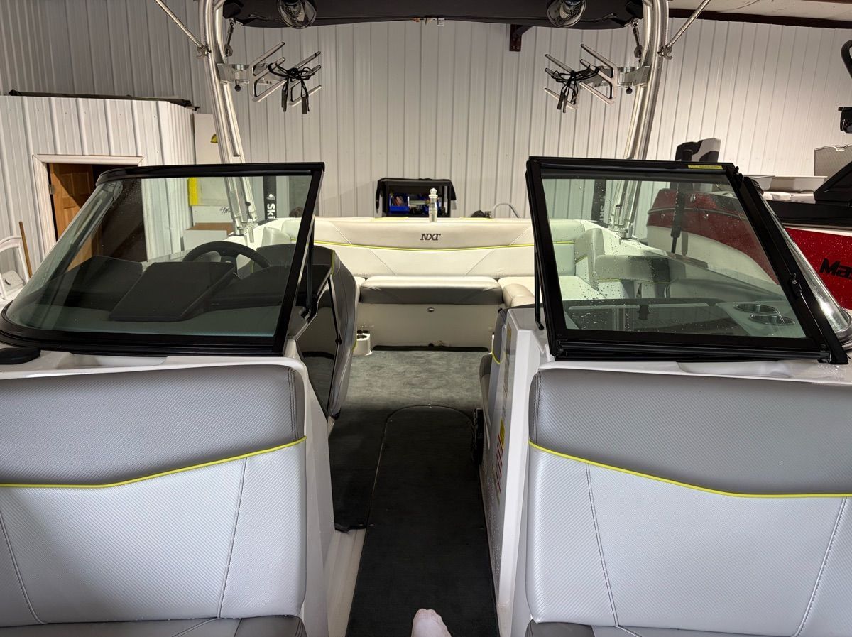 Interior view of a 2017 MasterCraft NXT22 boat with gray and white seating.