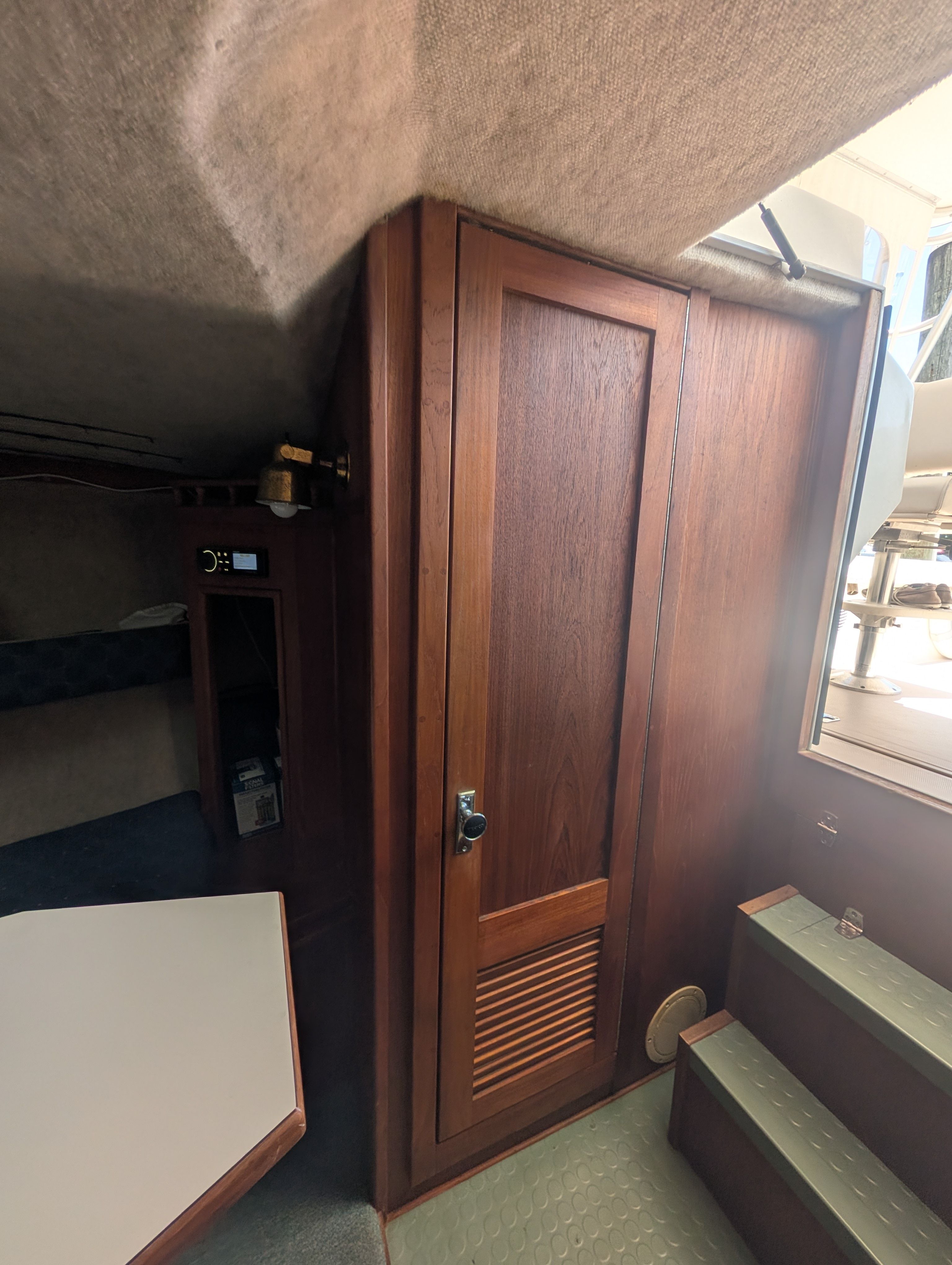 Interior of a 1997 Albemarle 265 with wooden doors and stairs.
