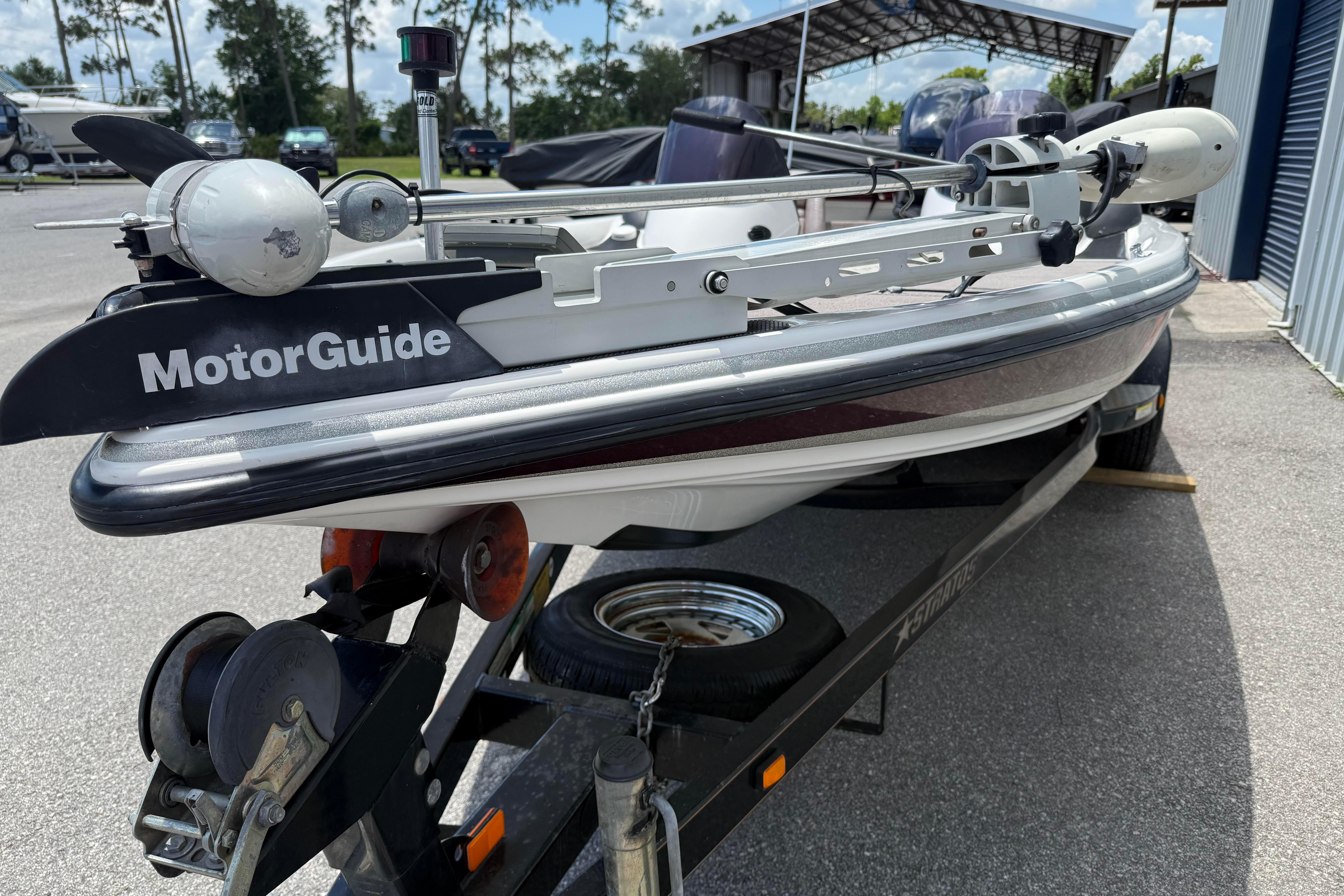 2006 Stratos 294 Pro XL boat with MotorGuide trolling motor on trailer.