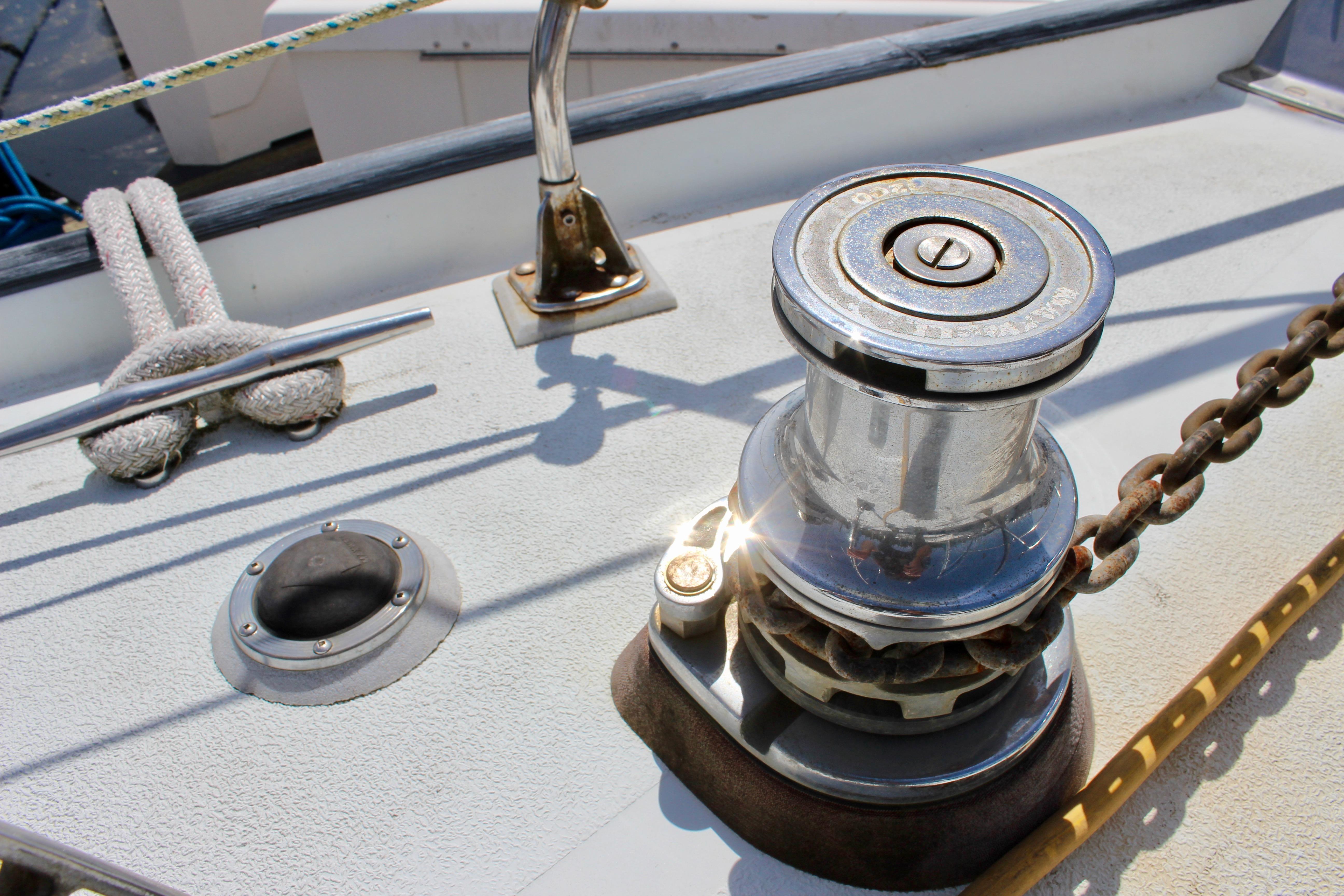 Deck of 1993 Freya 39 sailboat featuring winch and cleat with rope.