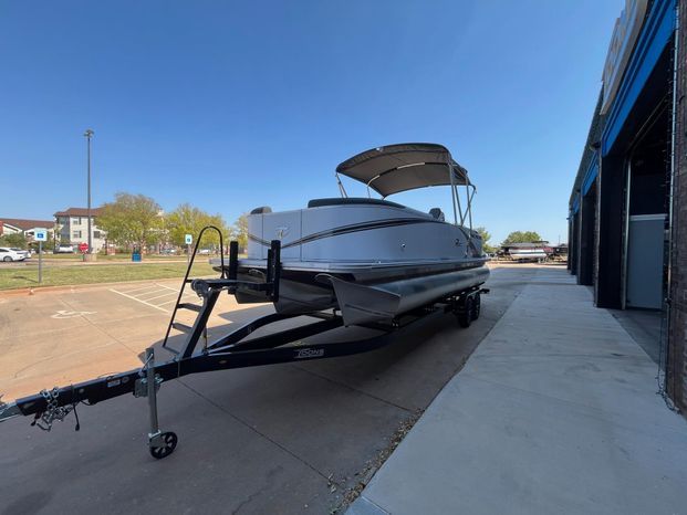 2025 Tahoe LTZ QL pontoon boat on trailer outdoors.
