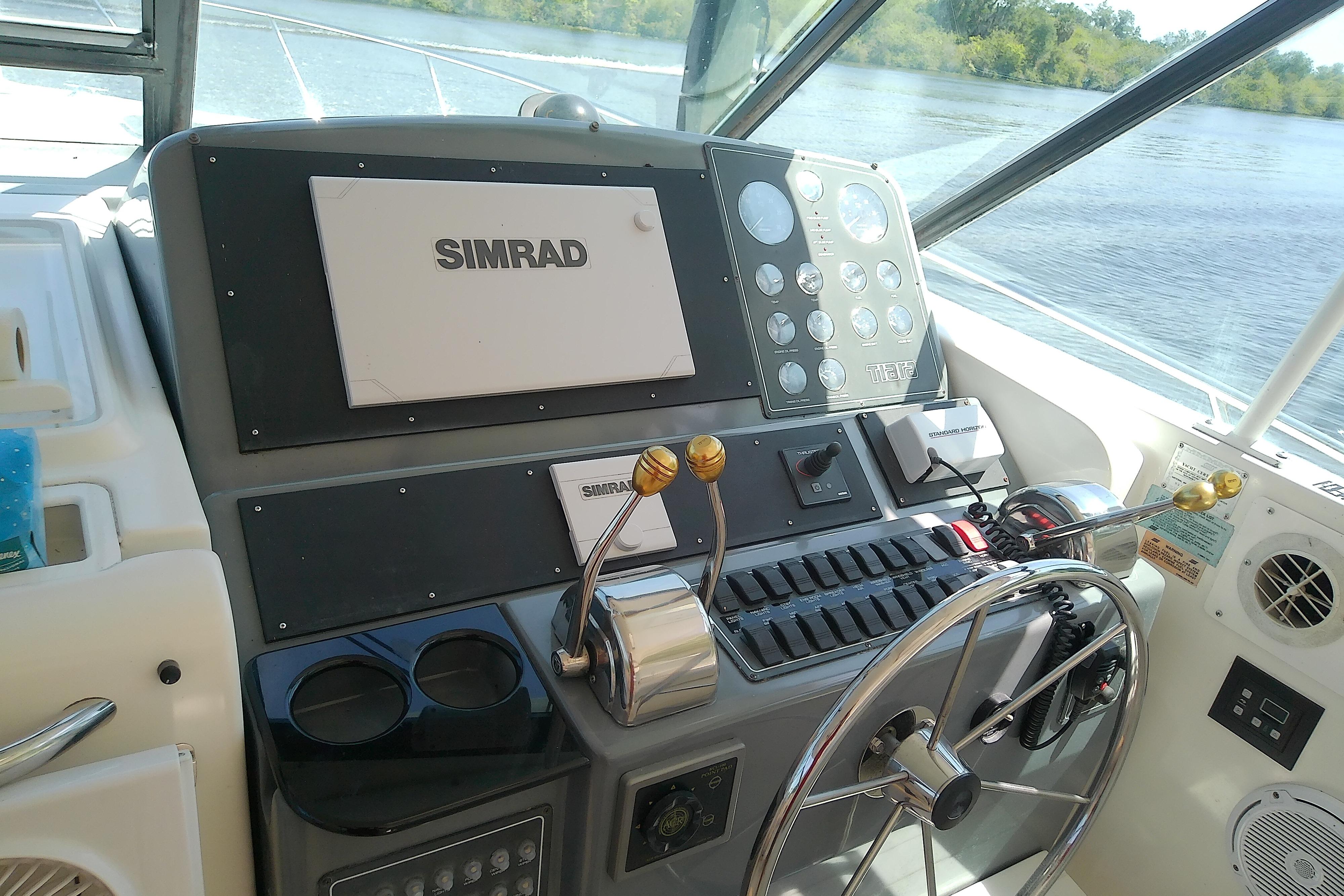 Helm of 2000 Tiara Yachts 4100 Open with Simrad navigation system.