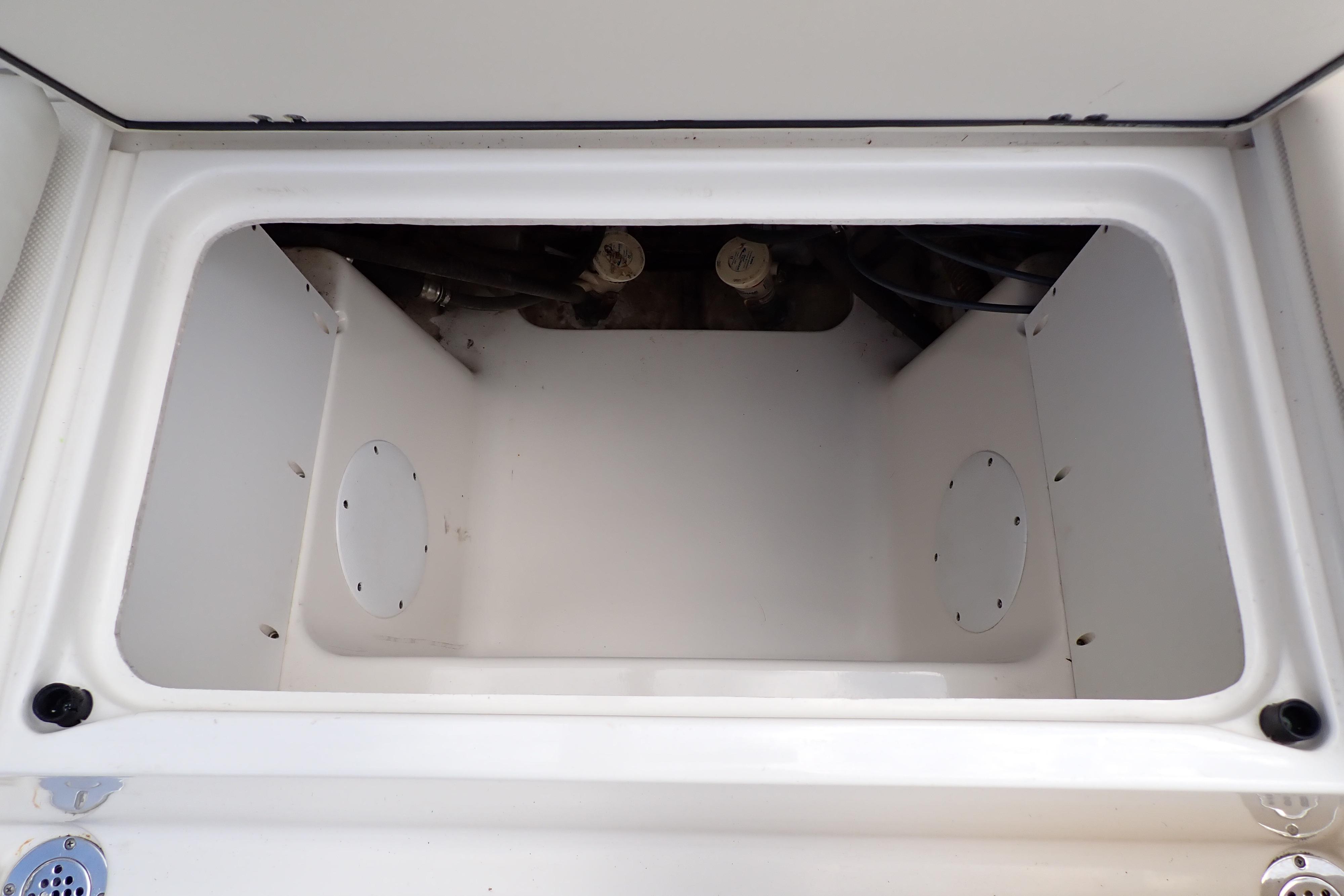 Open storage compartment in 2019 Key West 263 FS boat.