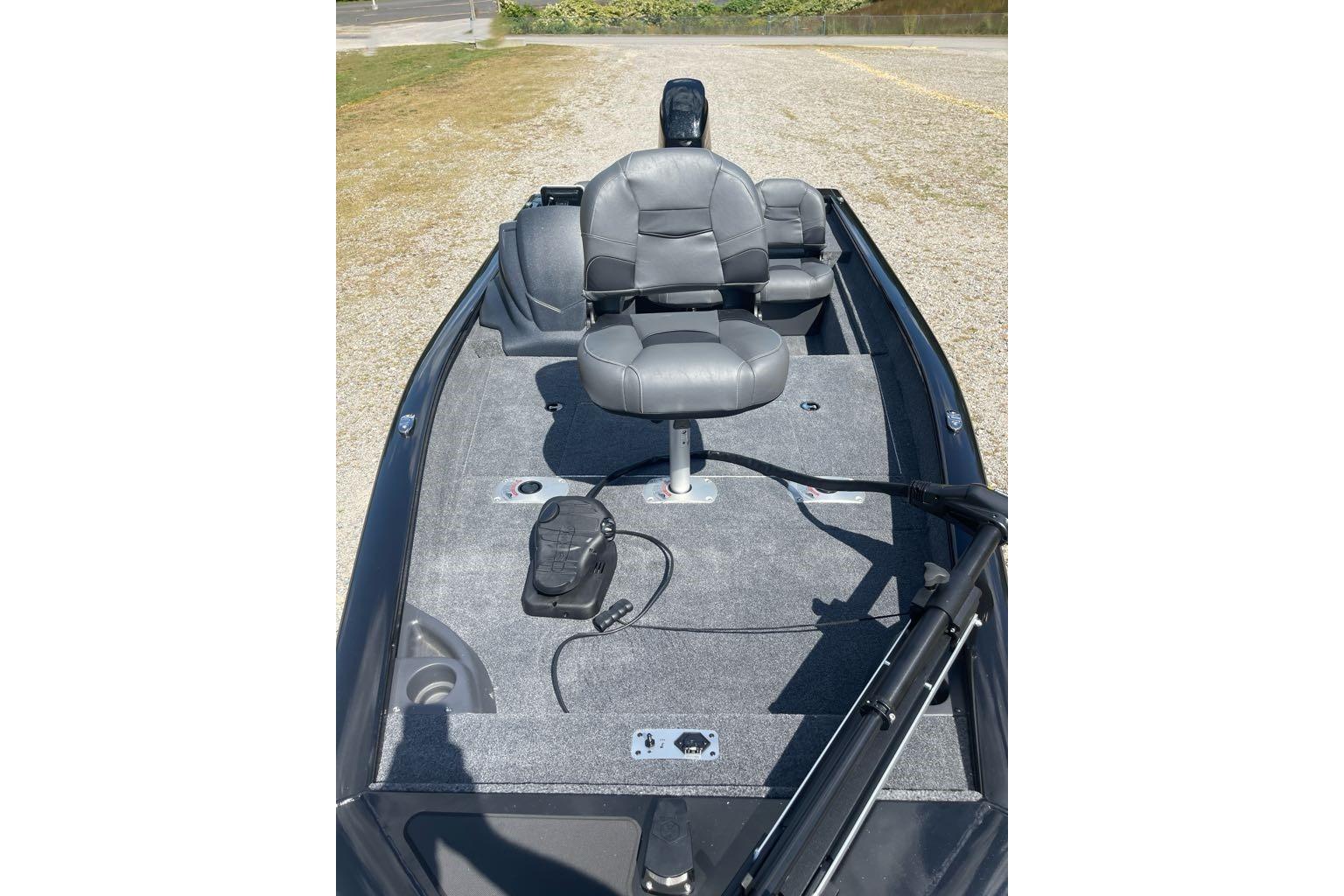 2026 Tracker Pro Team 175 Crappie Edition boat interior with gray seating and fishing equipment.