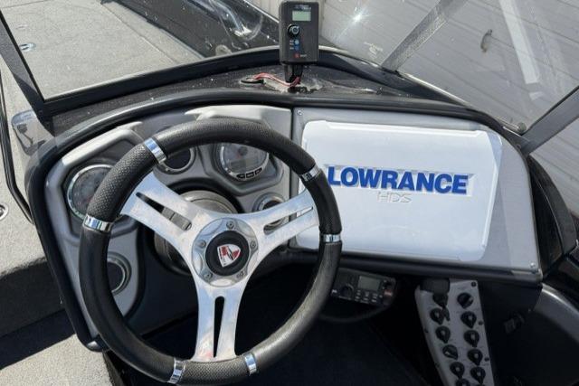 2016 Triton 216 Fishunter dashboard with Lowrance HDS system and steering wheel.