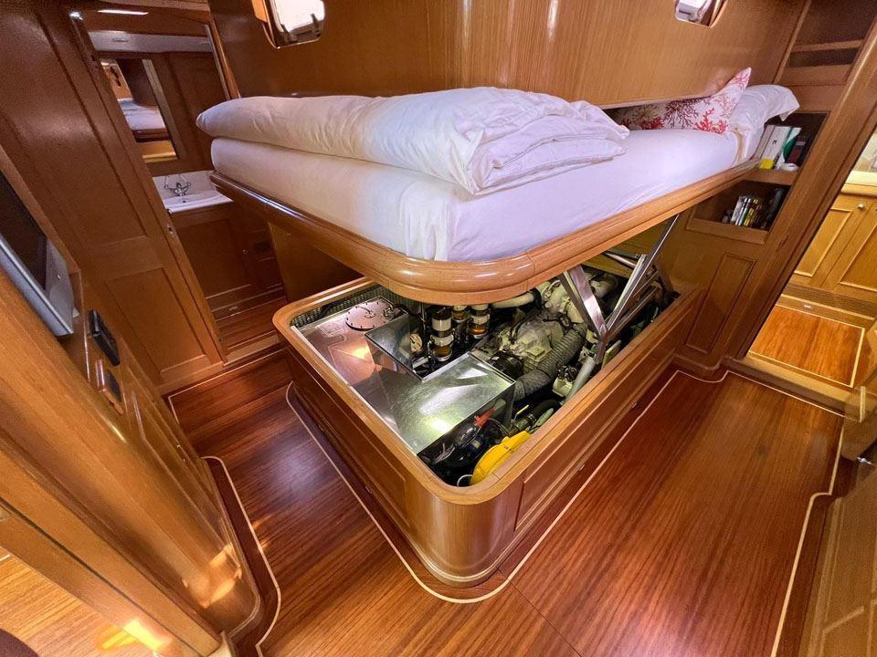Luxurious 2006 Custom Felci 71 yacht interior with engine access under bed.