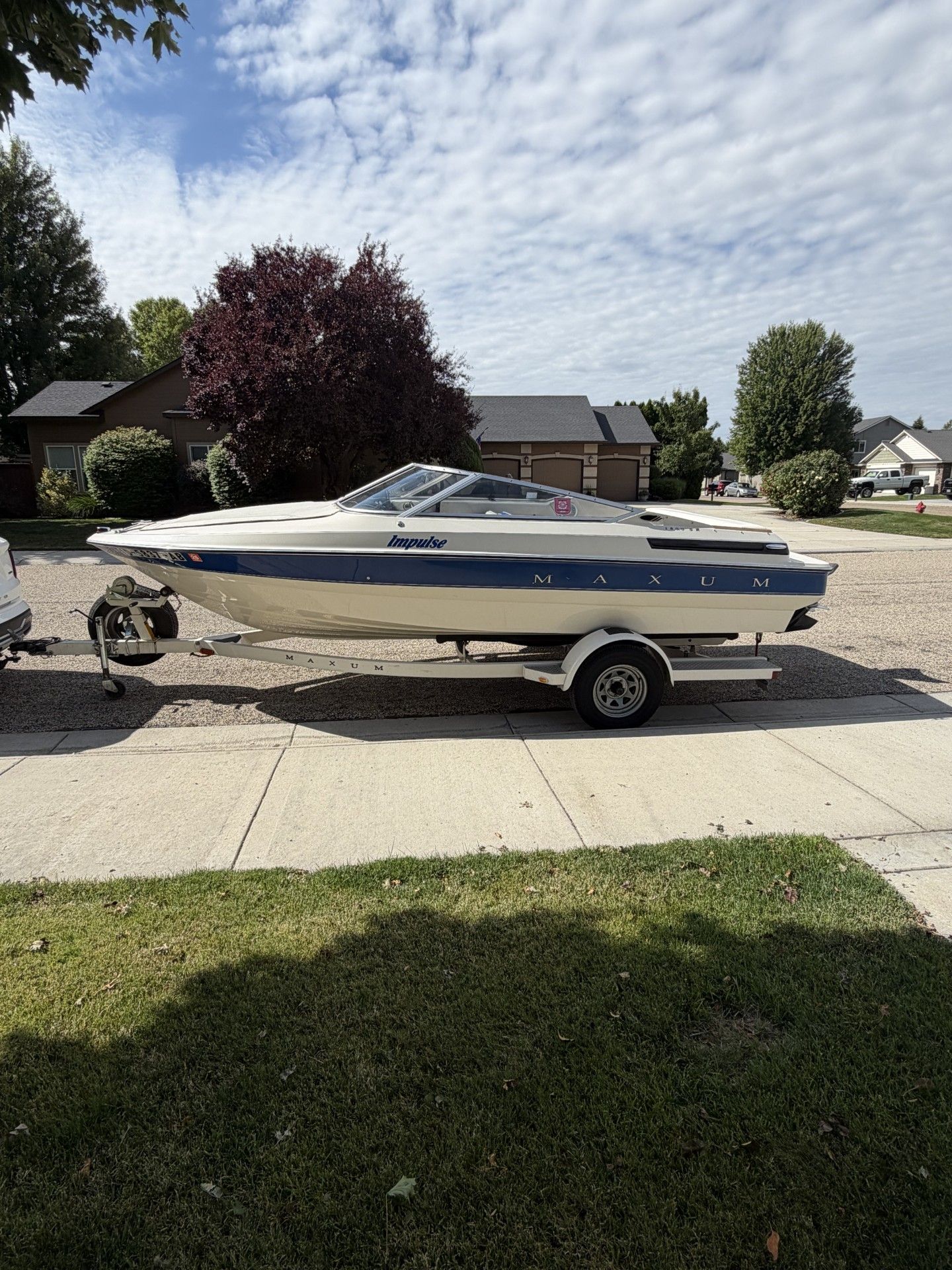 1991 Maxum 1800 SR on a trailer in a residential area.