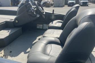 2019 Tracker Pro Team 190 TX boat interior with three seats and steering console.