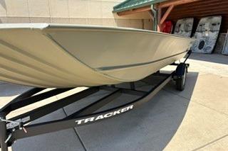 2025 Tracker Grizzly 2072 Utility boat on trailer, displayed outdoors.