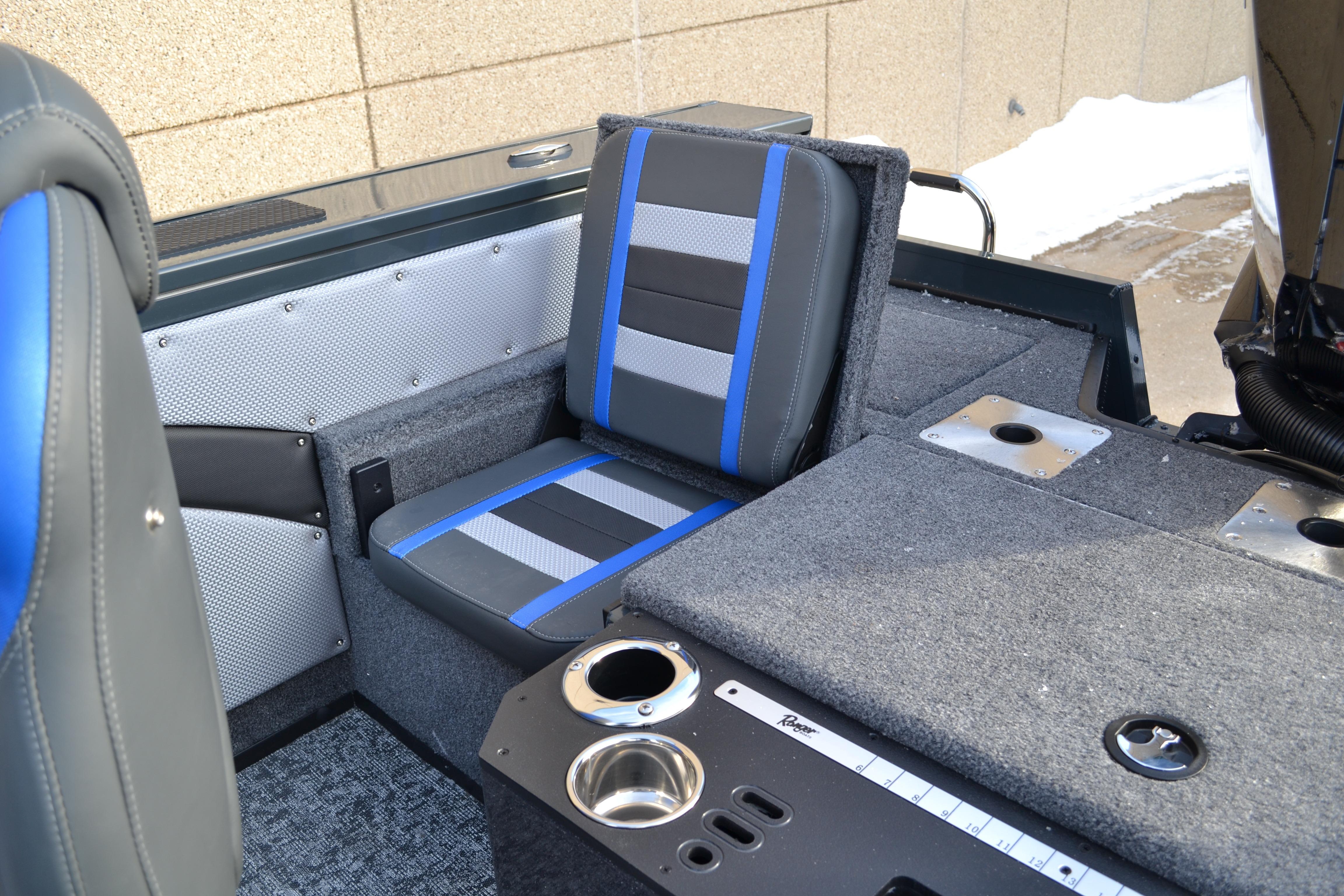 2026 Ranger VX1888 WT boat interior with blue-accented seating and cup holders.