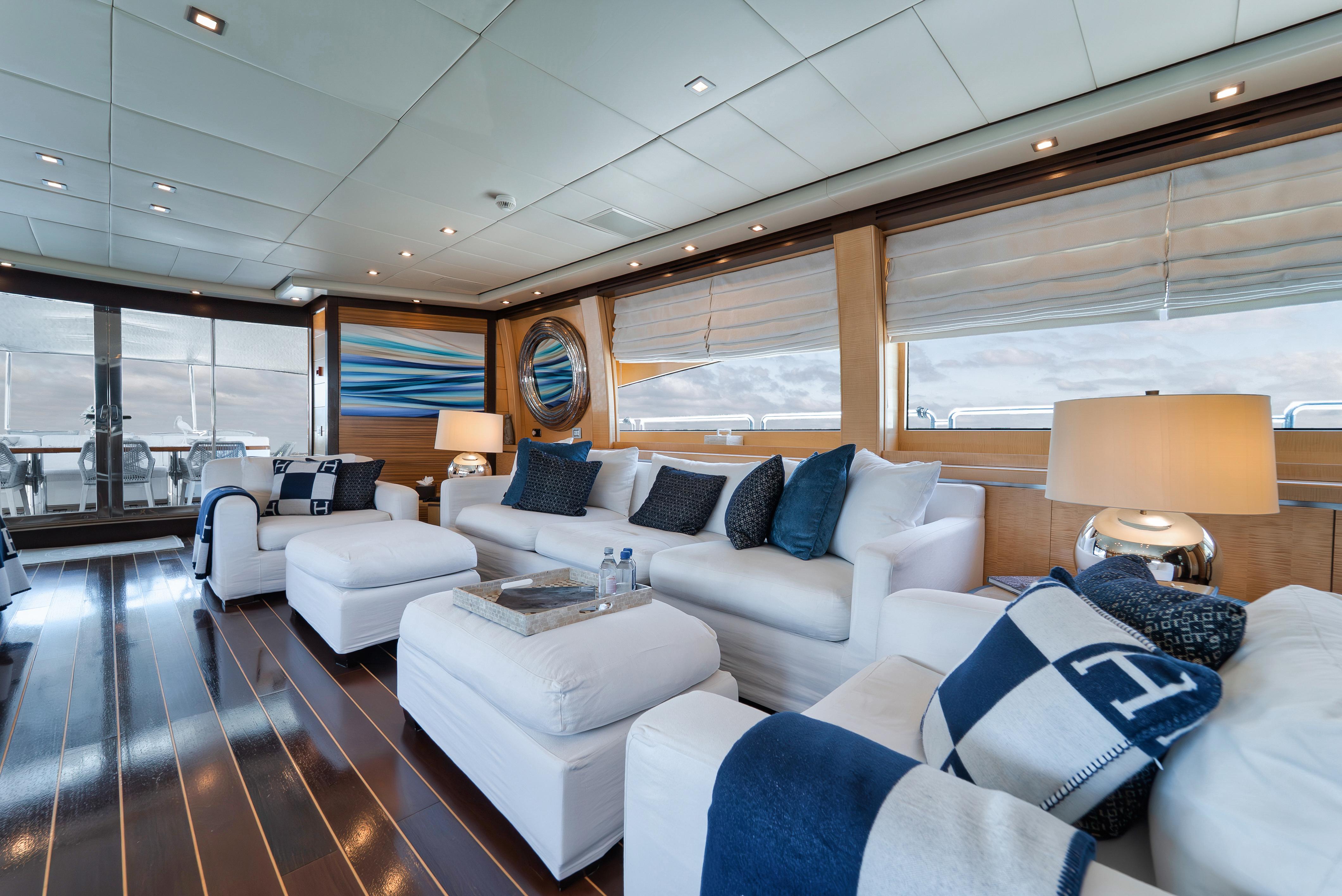 Luxurious interior of 2010 Arno Leopard 46 yacht with elegant white seating and nautical decor.