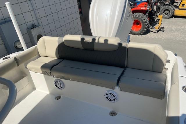 2026 Key West 239 FS boat interior with cushioned seating and built-in speakers.