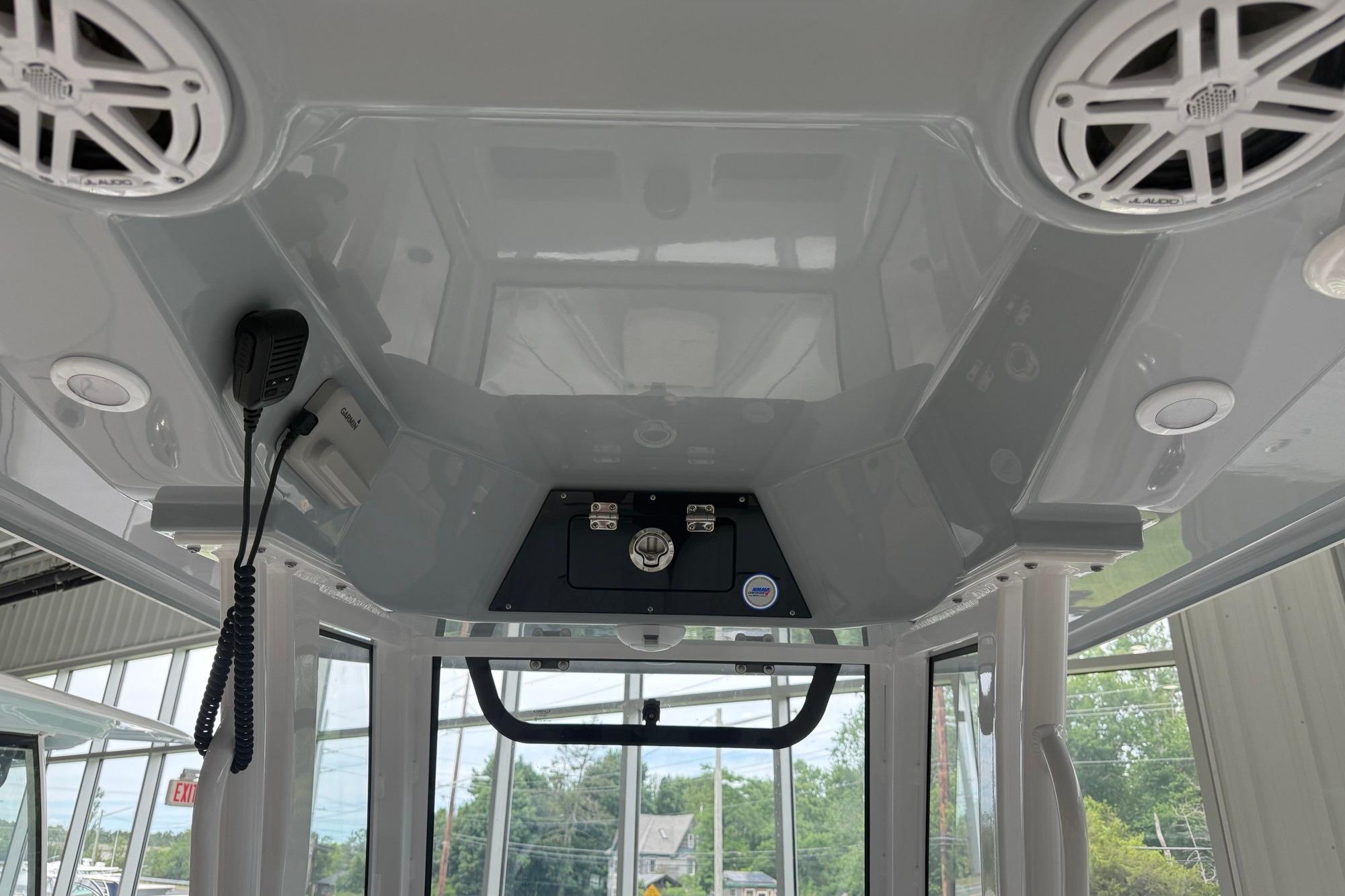 2026 Sportsman Open 252 Center Console boat interior with speakers and communication equipment.