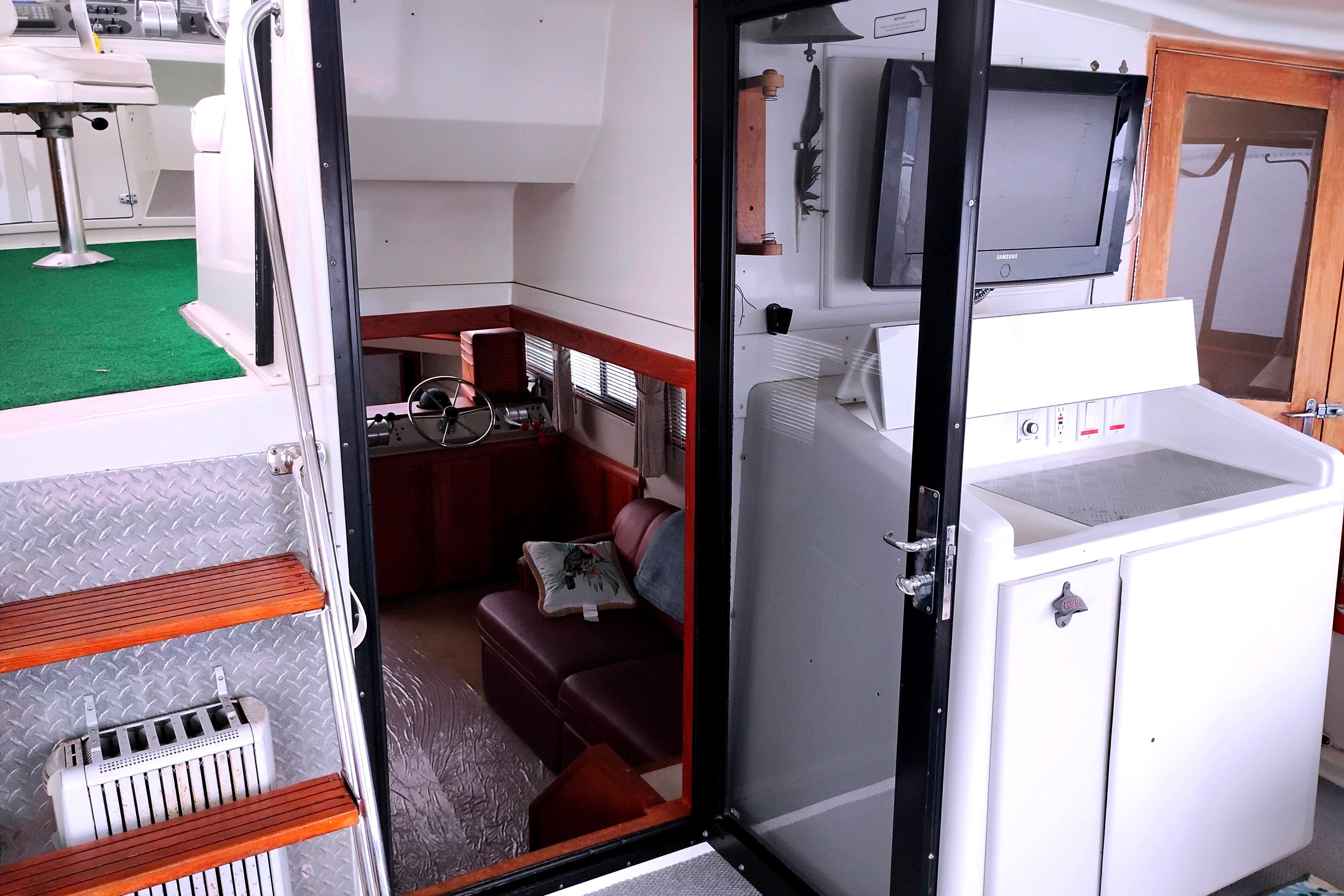 Interior of 1991 Californian 52 Cockpit Motor Yacht with seating and control area.
