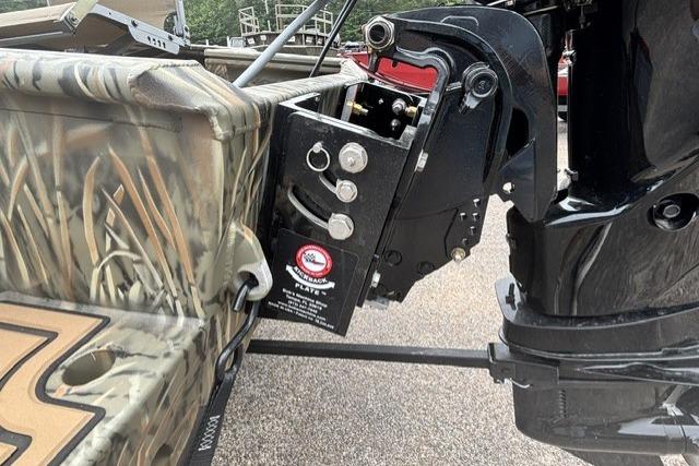 2026 Tracker Grizzly 1650 T Prairie Wings Edition boat with camouflage design and motor mount detail.