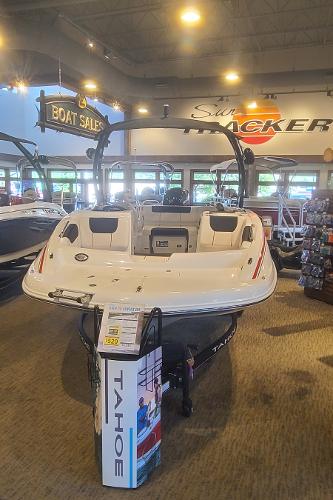 2023 Tahoe 1950 boat on display at a dealership.