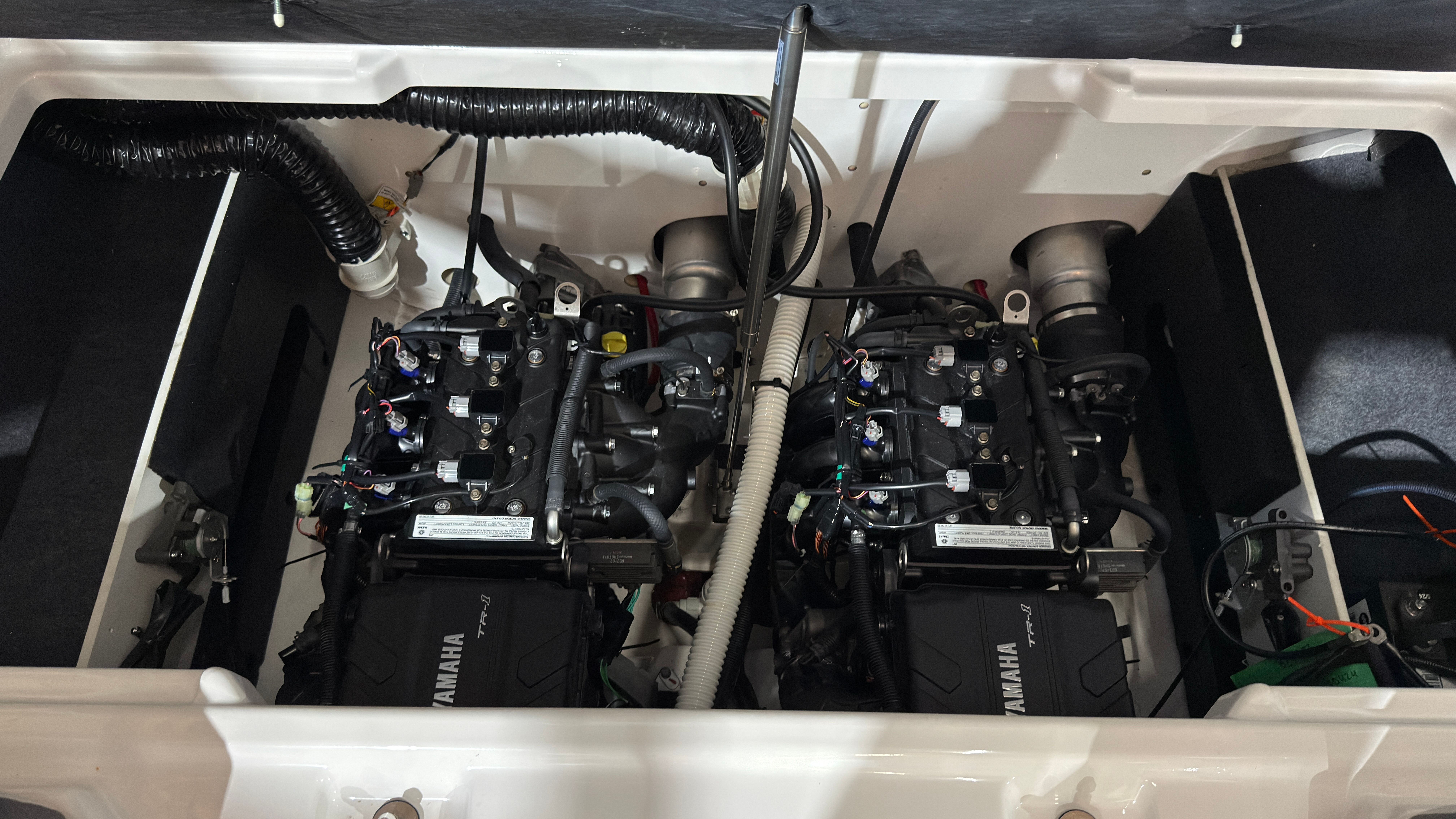 2024 Yamaha AR220 boat engines in engine compartment.