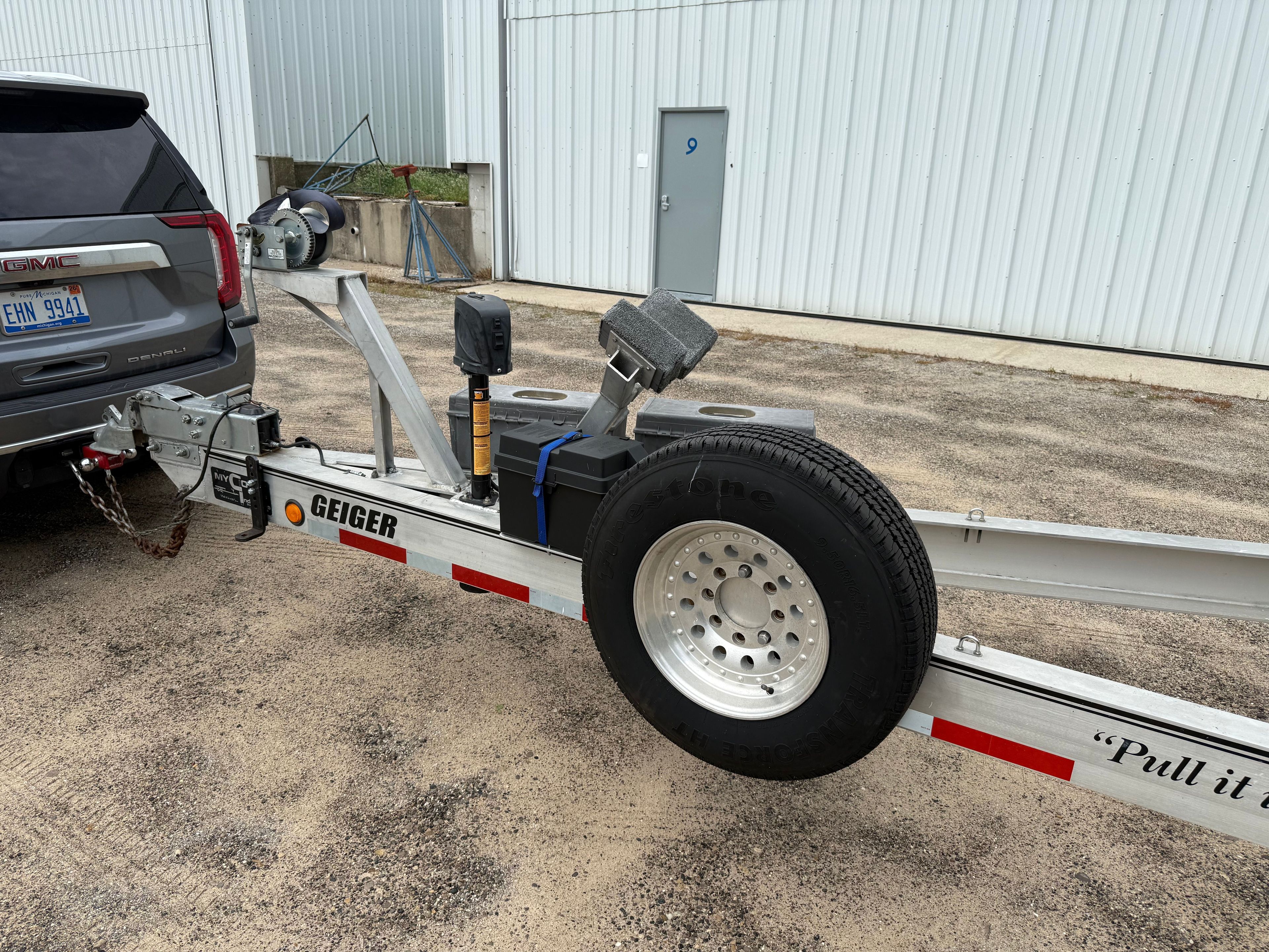 Trailer for Fountain 32 Sport Fish Cruiser, 1999 model, hitched to SUV.