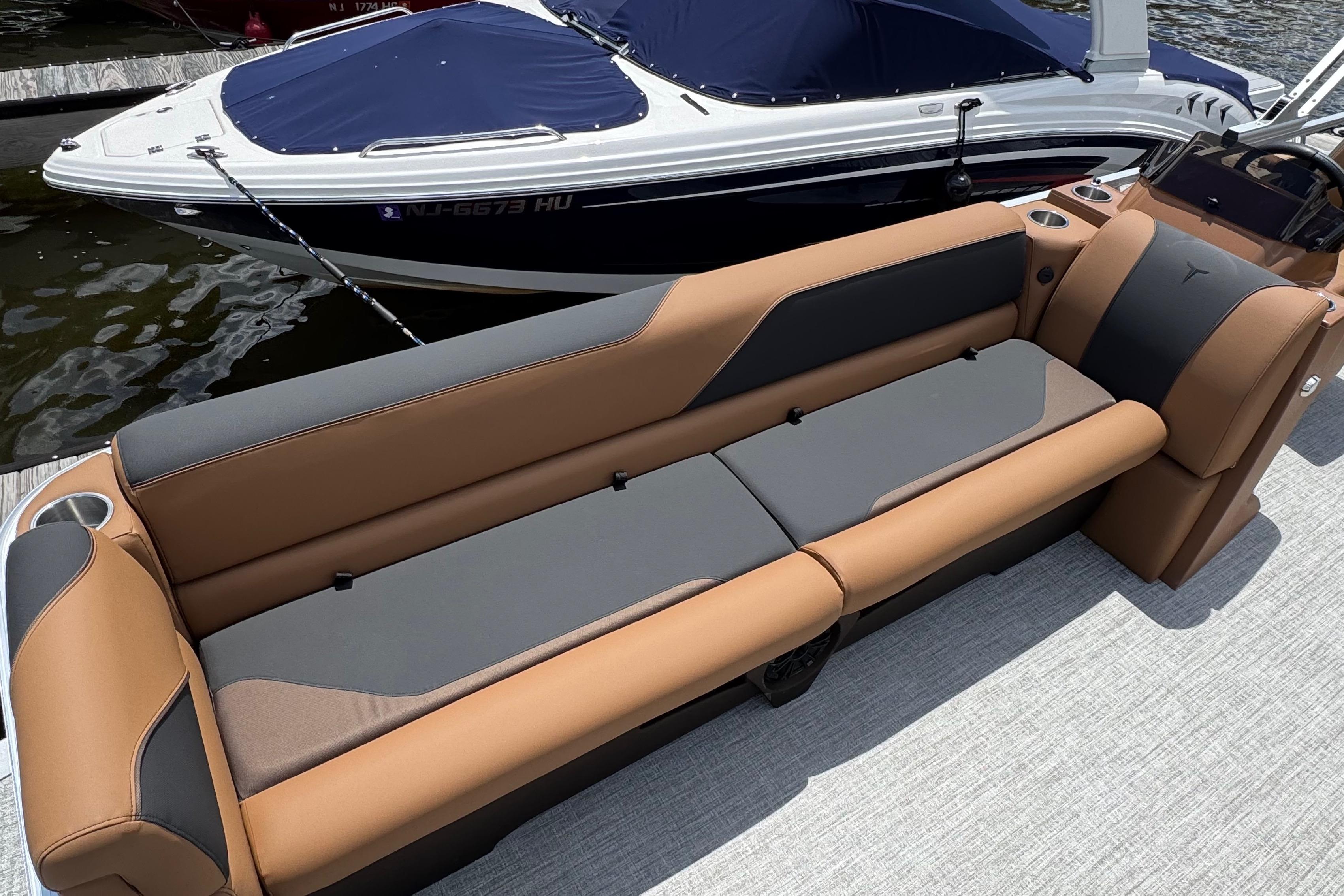 2026 Tahoe Pontoon Sport 85 Cruise Rear Bench 23 with luxurious seating on a docked boat.