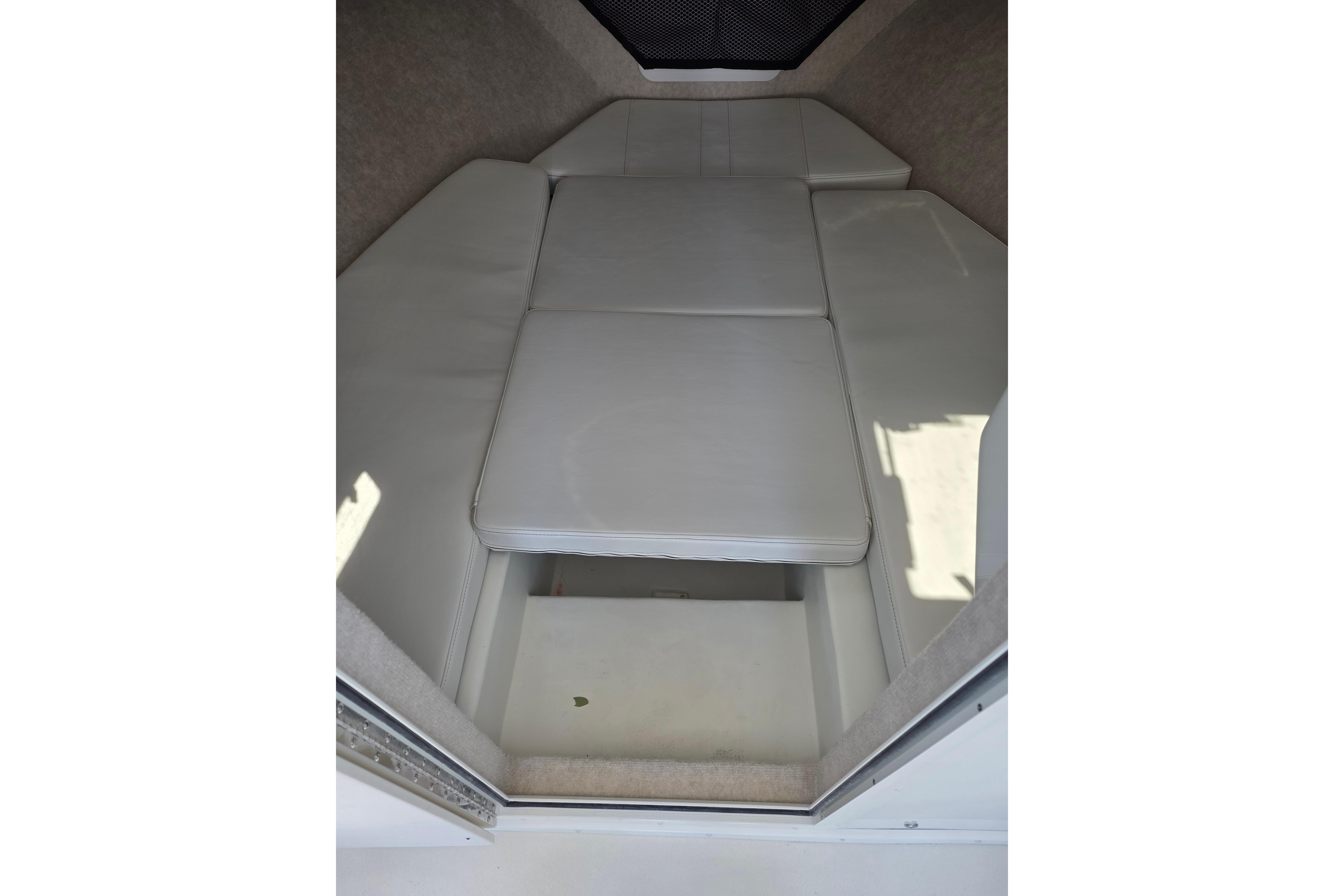 Interior cabin of 2026 Parker 287 Explorer boat with white cushioned seating.