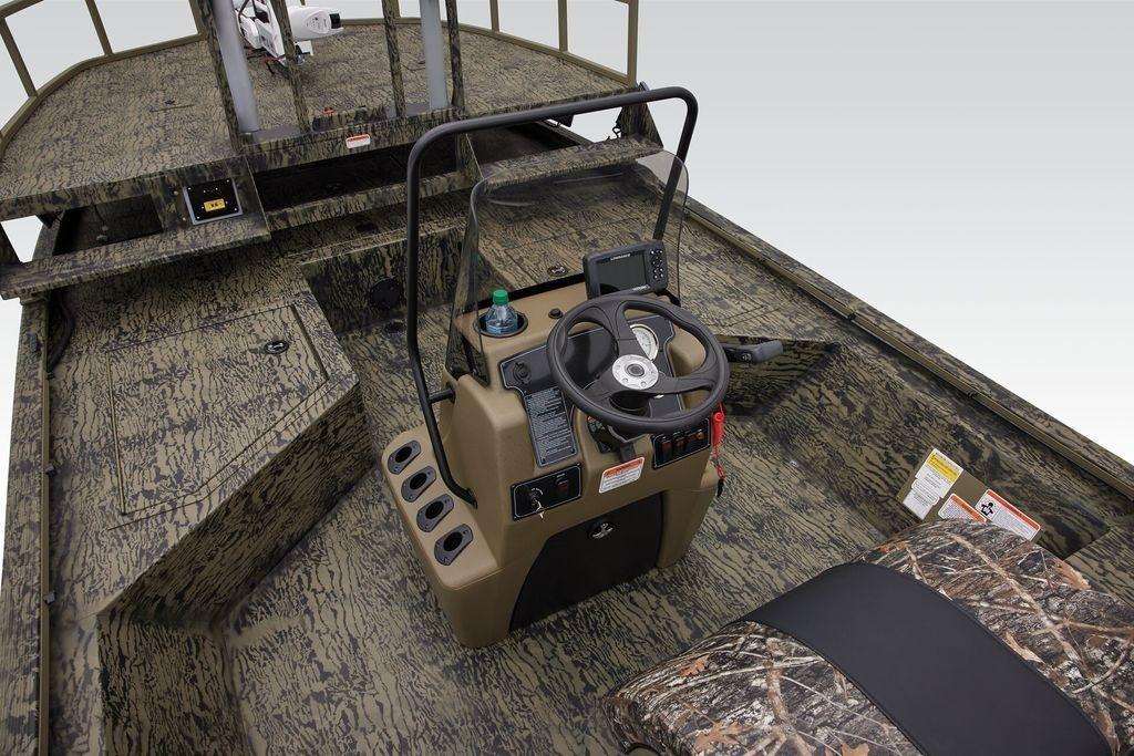 2026 Tracker GRIZZLY® 2072 CC Sportsman boat interior with camouflage design and steering console.