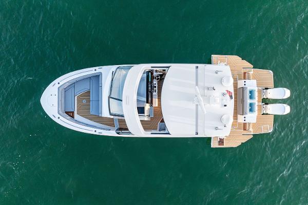 Manufacturer Provided Image: Aerial view of 2026 Regal LX43 yacht on clear blue water.
