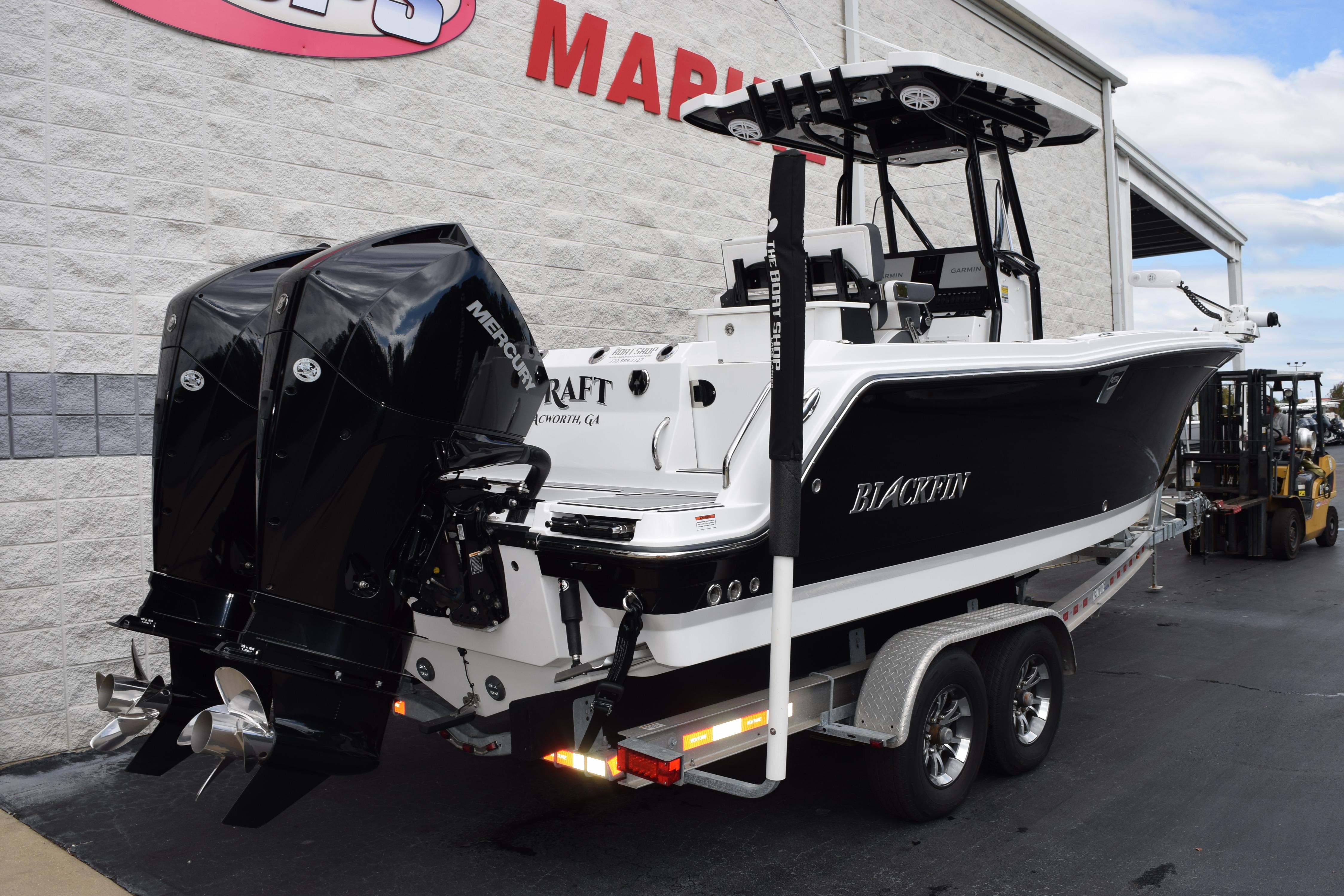 2023 Blackfin 252 CC boat with dual Mercury engines on a trailer.