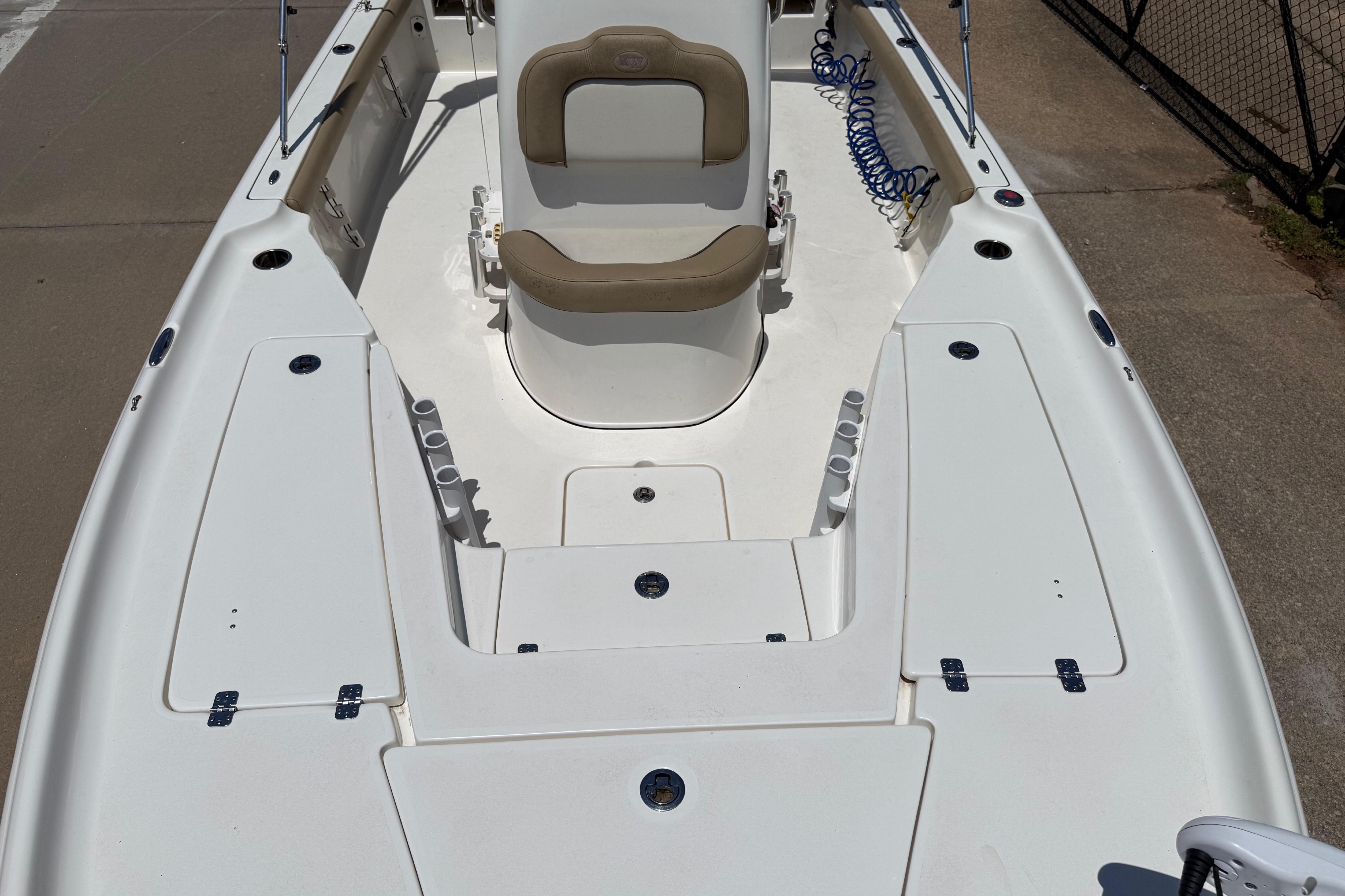 2019 Key West 230 Bay Reef boat interior with seating and storage compartments.