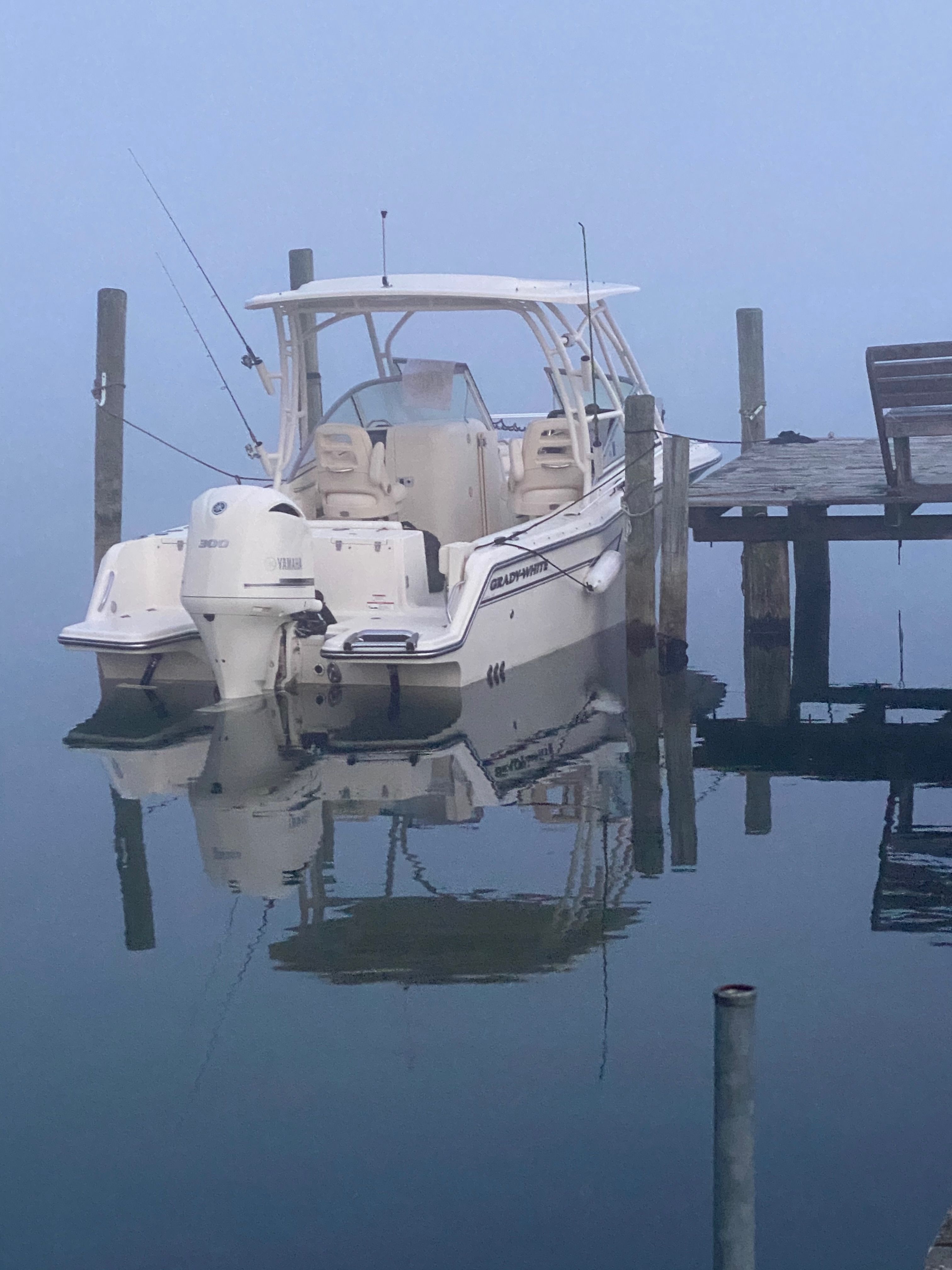 2018 Grady-White Freedom235 boat docked in foggy conditions.