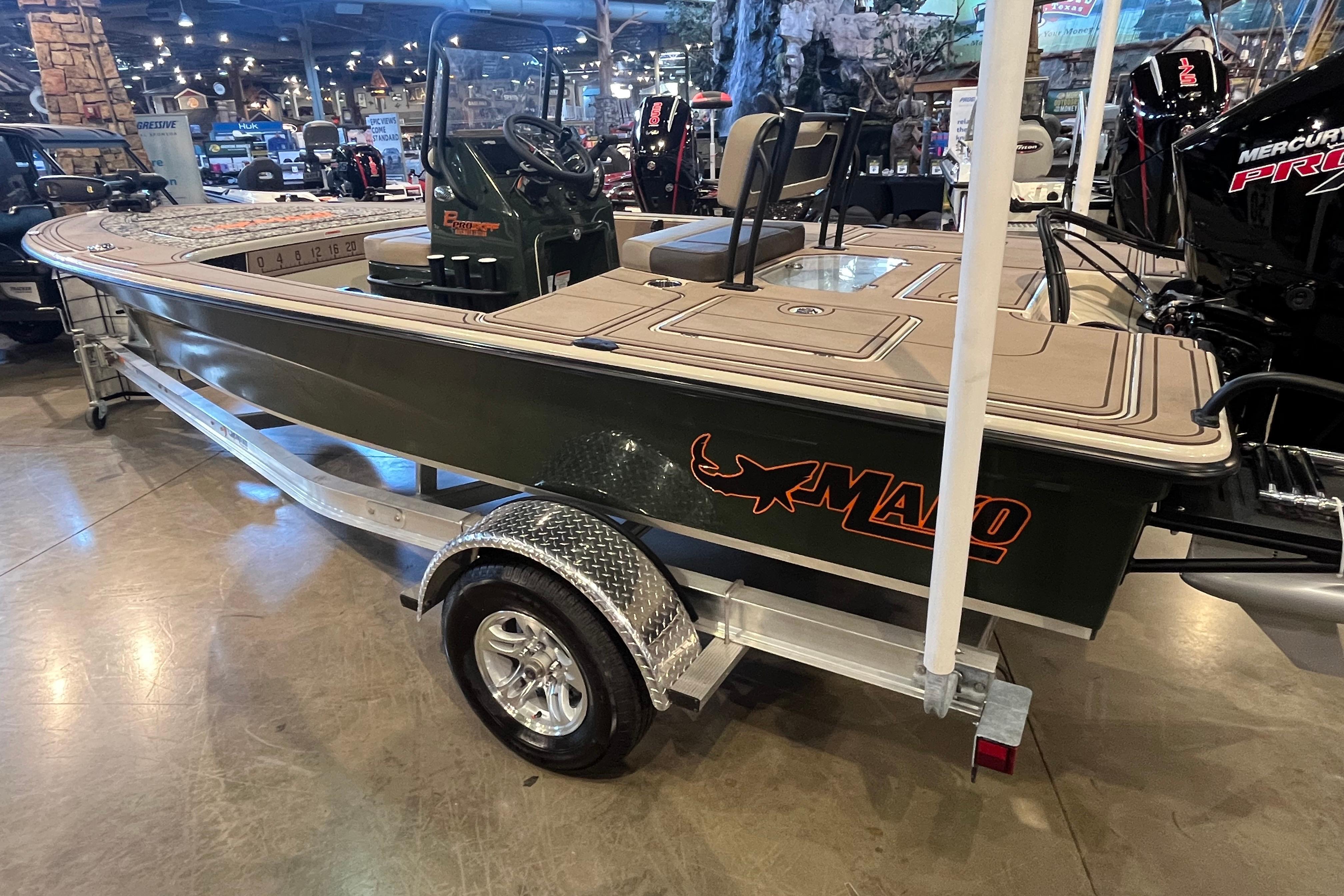 2025 Mako 18 Pro Skiff Backwater Edition on display in a showroom.