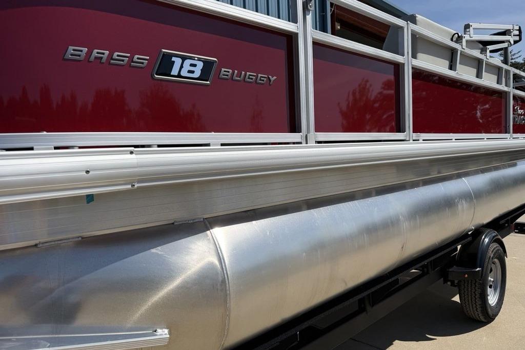 2026 Sun Tracker Bass Buggy 18 DLX pontoon boat with red and silver design.