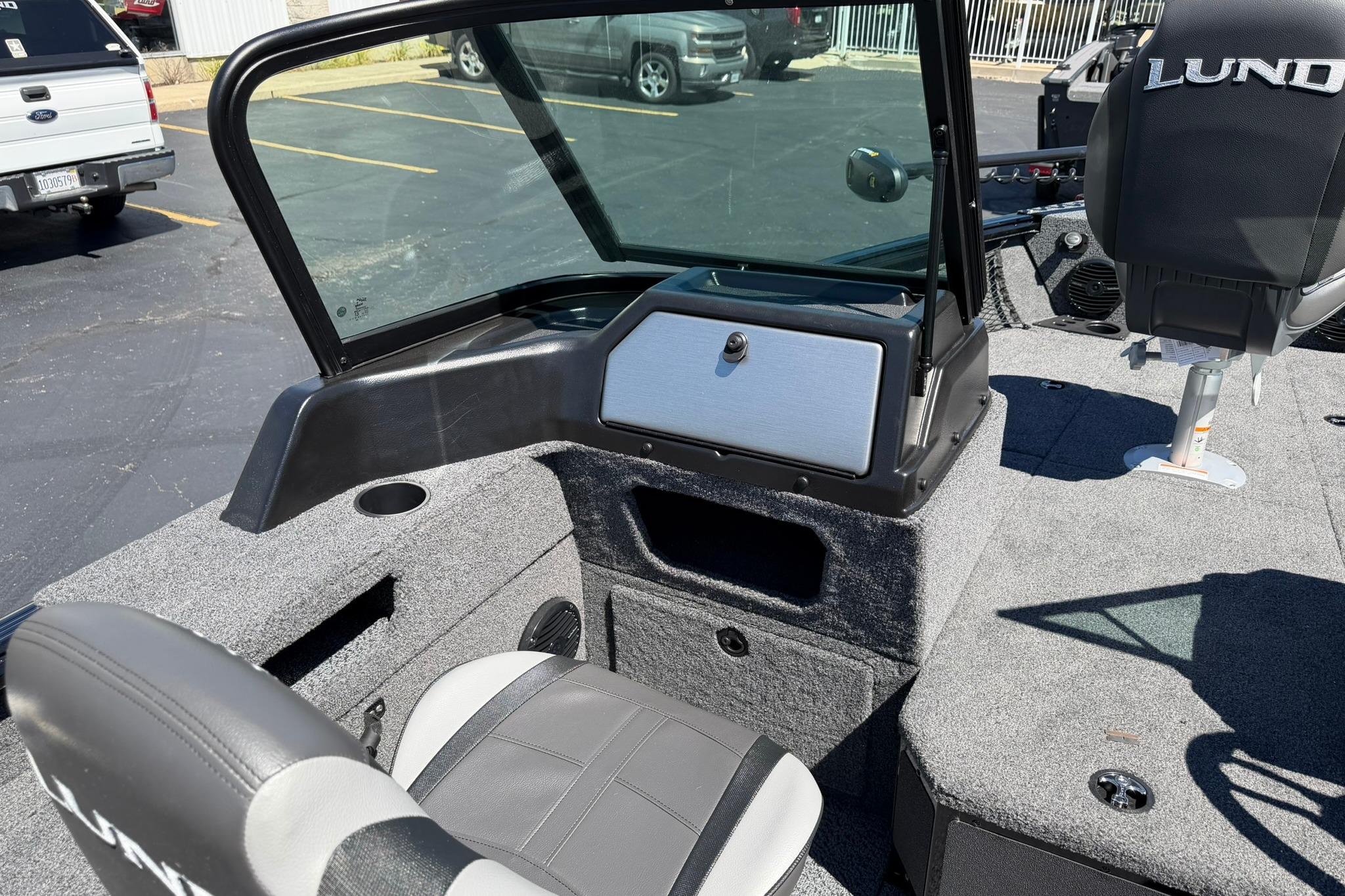 2027 Lund 1775 Impact XS Sport boat interior with seating and windshield.