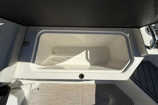Storage compartment on 2022 Sea Ray SPX 210 Outboard boat, featuring sleek design and functionality.
