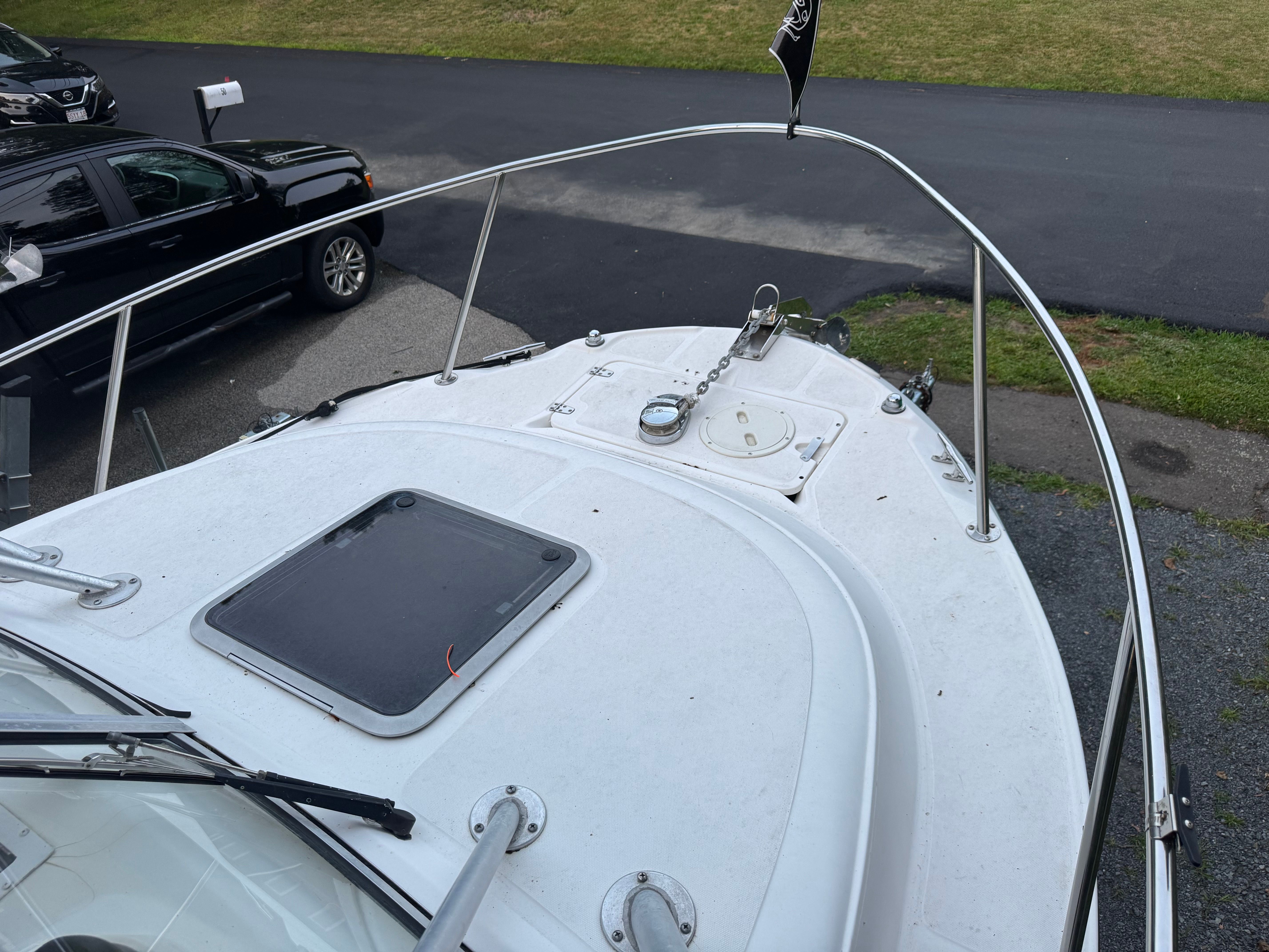 Boston Whaler Conquest 2000 on a parking lot, bow deck view.