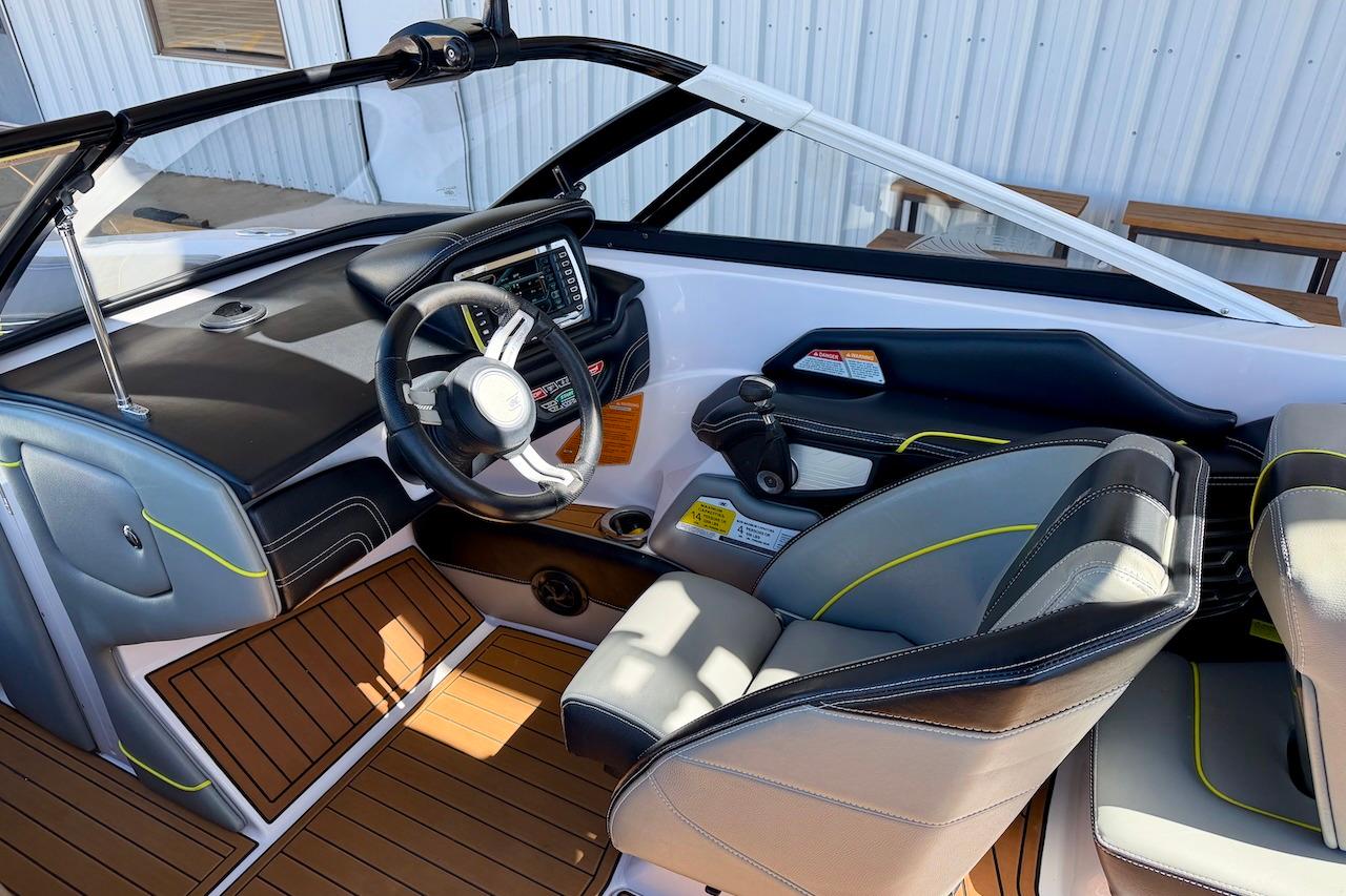 2014 Nautique Super Air Nautique G21 boat interior with modern dashboard and seating.