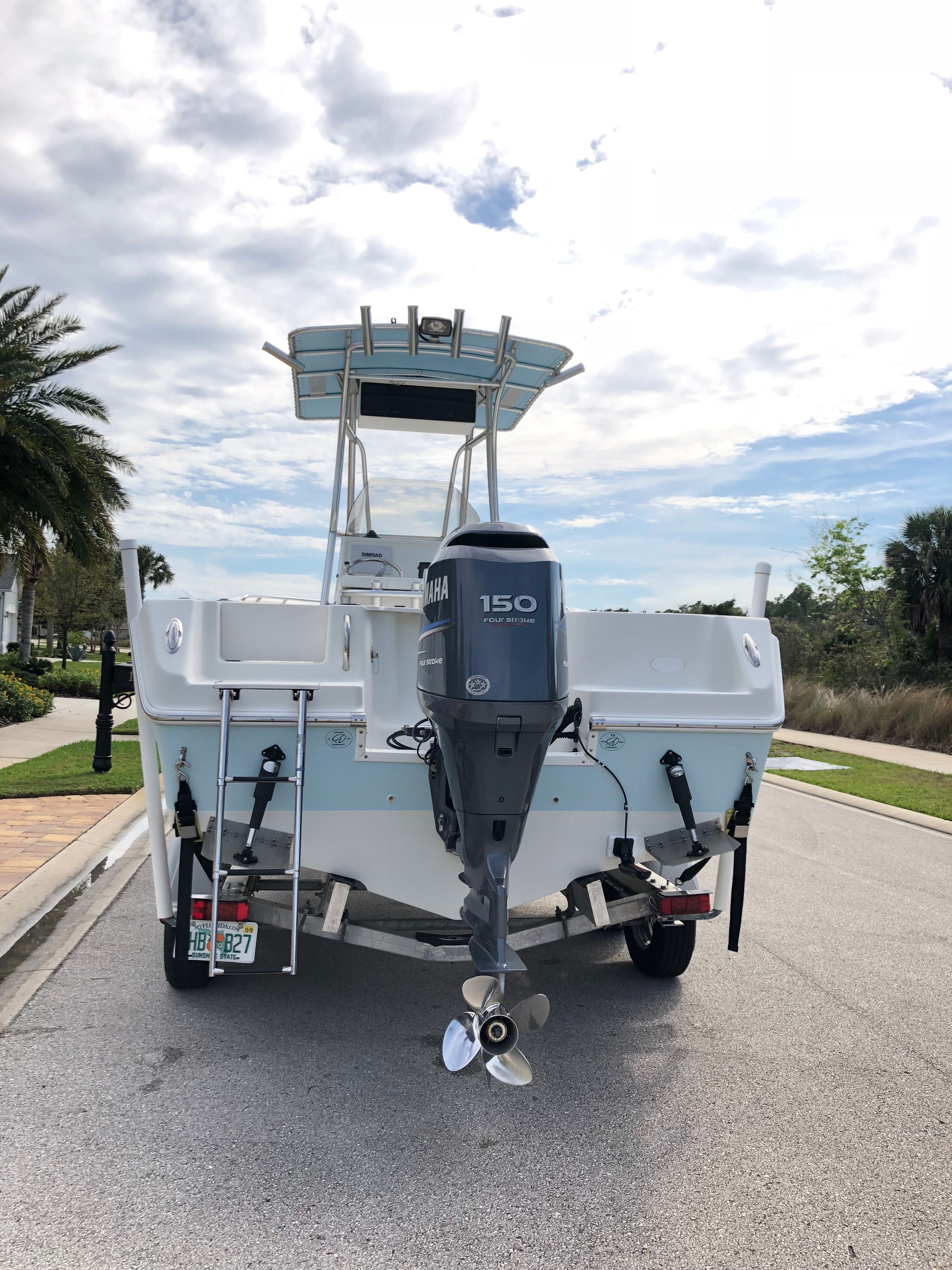 2006 Sailfish 218 CC boat on trailer, rear view.