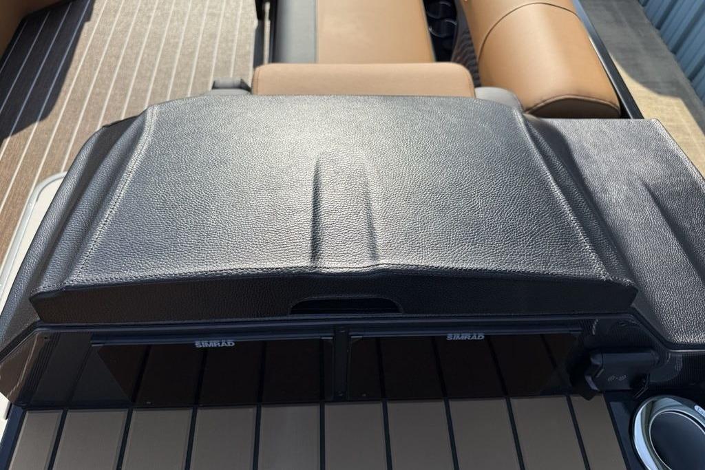 Dashboard of 2026 Premier 250 Solaris RS CL boat with leather finish and Simrad display.