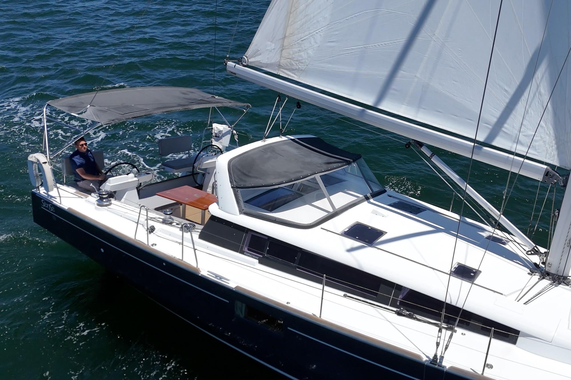 2017 Beneteau Sense 50 sailing on open water, featuring sleek design and spacious deck.
