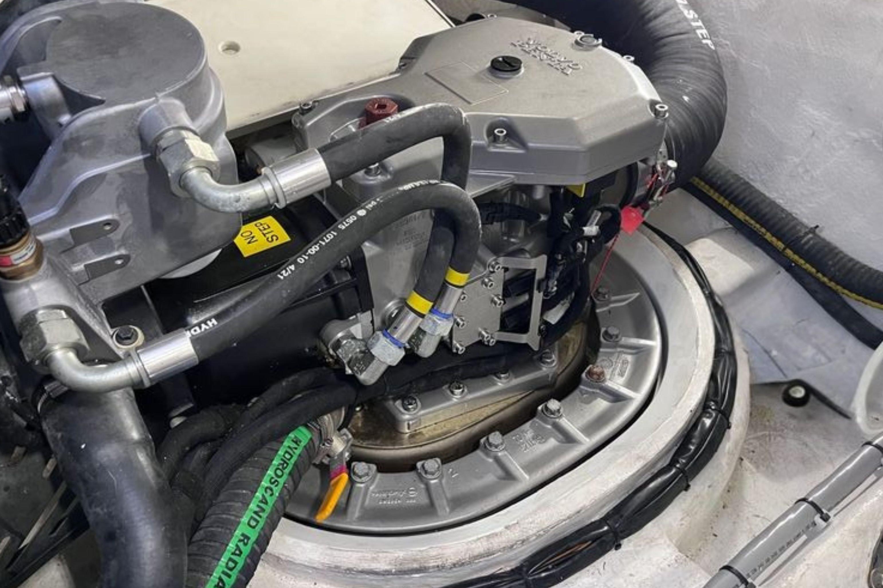 Engine compartment of 2024 Galeon 425 HTS yacht, showcasing mechanical components and hoses.