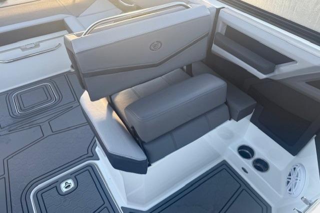 2023 Cobalt R6 Surf boat interior with gray seating and modern design.