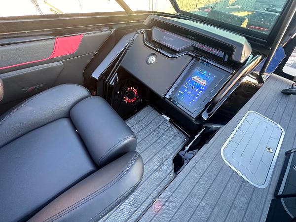Luxurious 2025 Godfrey XP 2700 W boat interior with advanced control panel and sleek seating.