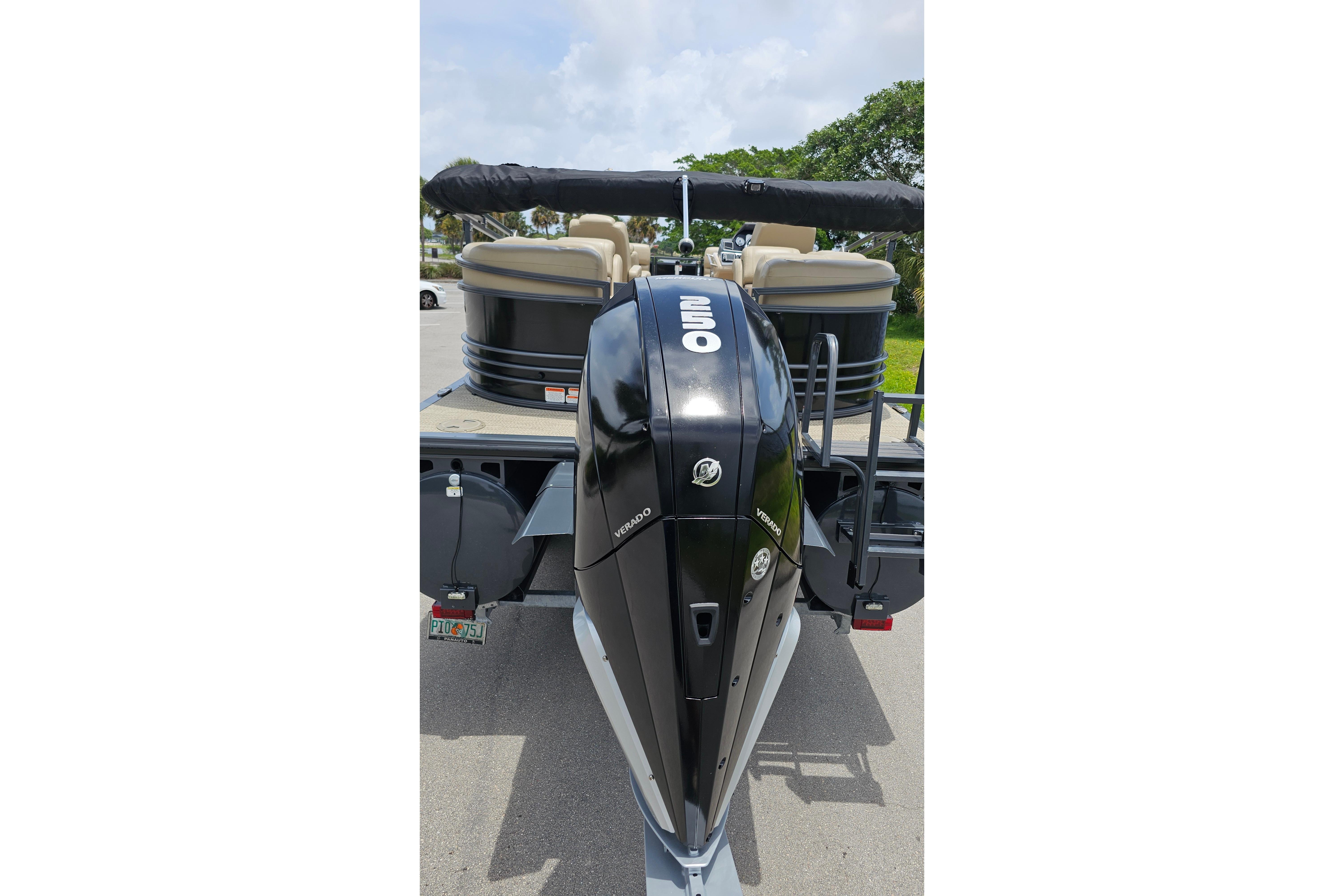 2020 Regency 230 LE3 pontoon boat with powerful outboard motor on trailer.