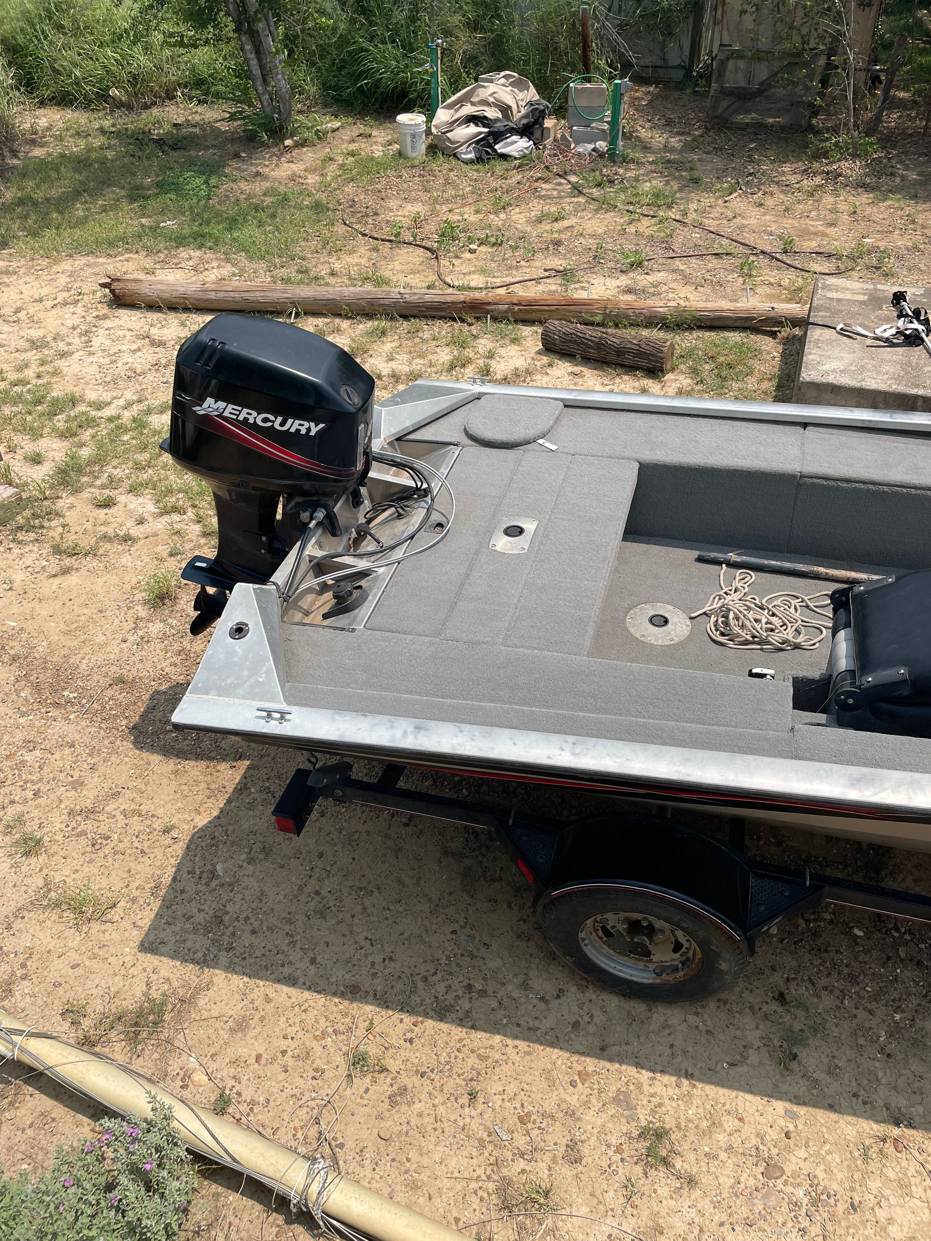 A 2009 Tracker Pro Crappie 175 boat on a trailer, featuring a Mercury outboard motor.